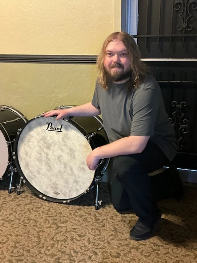 Photo of Seth Gottberg with a bass drum