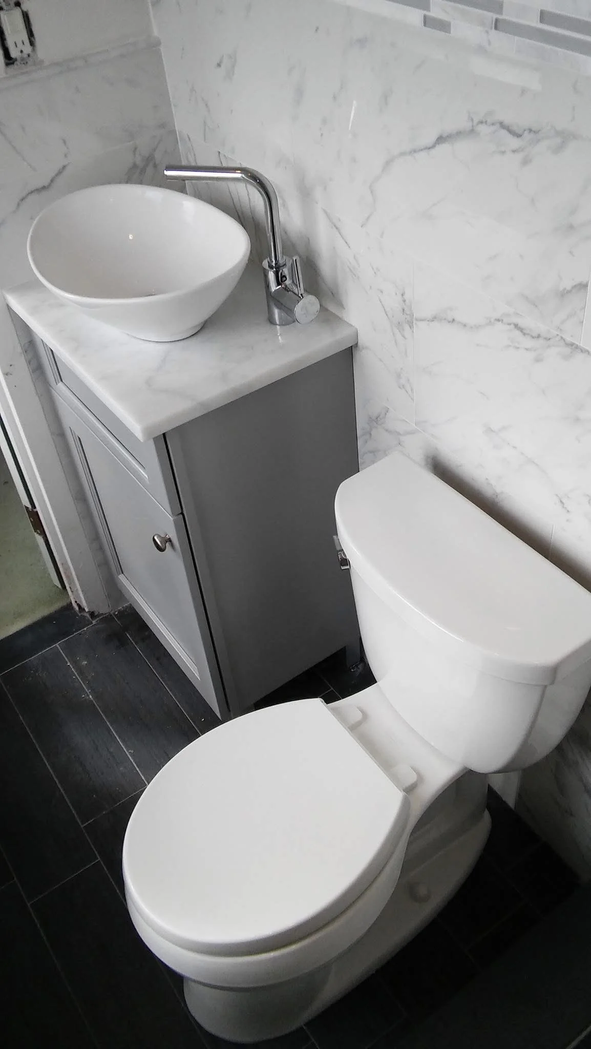 Bathroom remodel in Easton PA with white toilet and vanity sink installed by licensed master plumber Duran The Plumber LLC