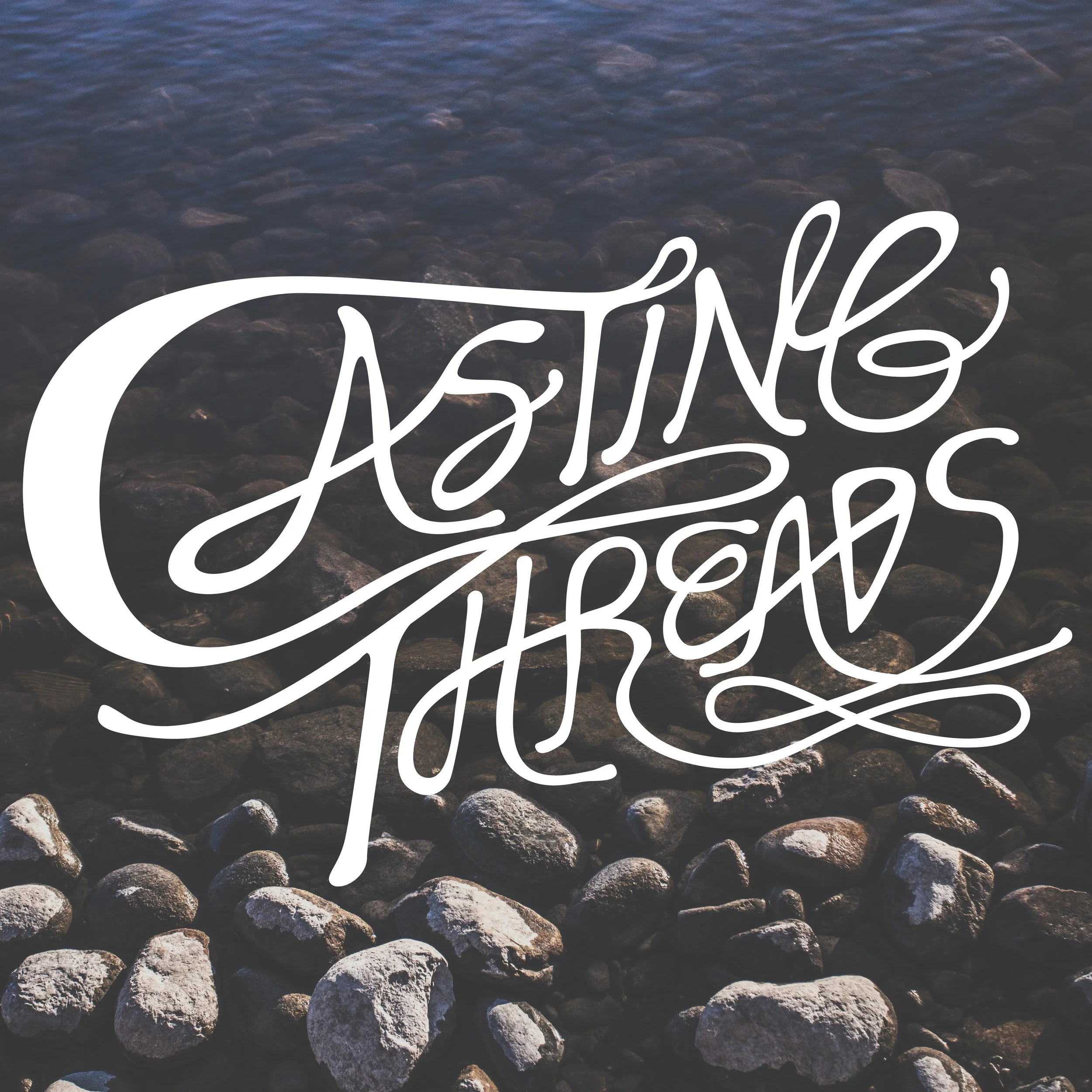 A rocky shoreline with the words 'Gasing Theres' written in white cursive text over the rocks.