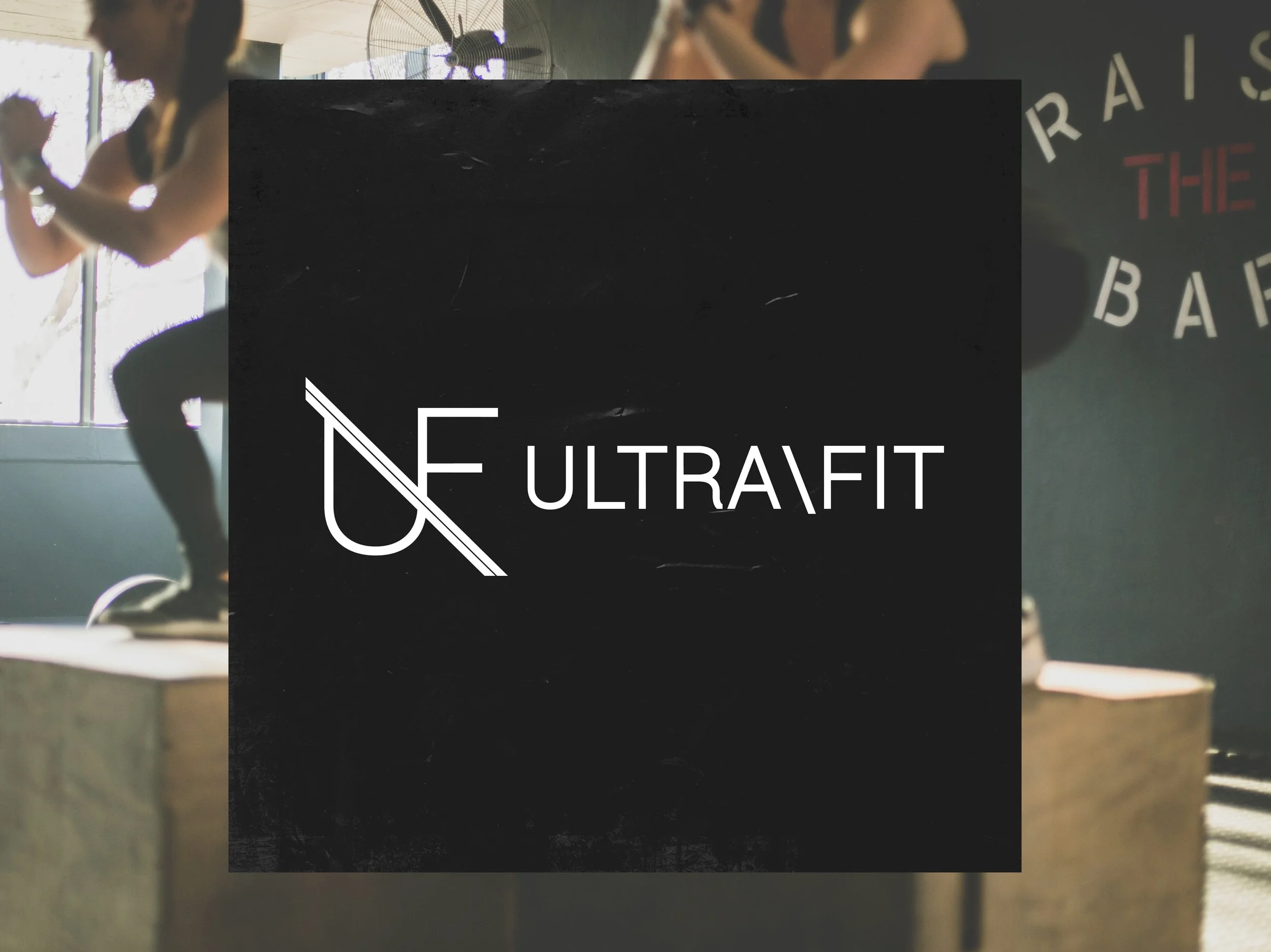 Fitness gym logo with the words "UltraFit" and a stylized letter "UF" beside it, over a background of people working out in a gym area with workout equipment.