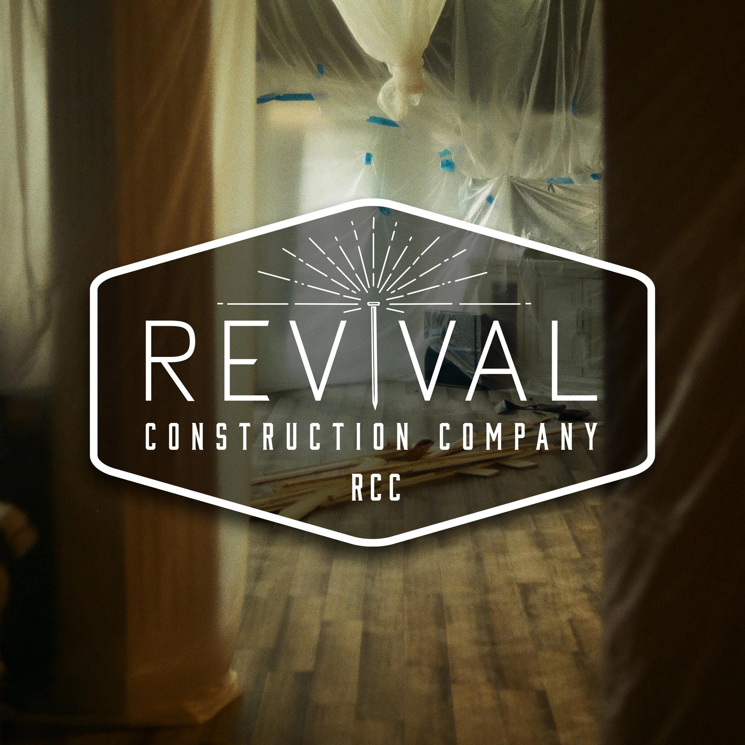 View of a room under construction with plastic sheeting and wooden planks, with a logo overlay reading 'Revival Construction Company RCC'.