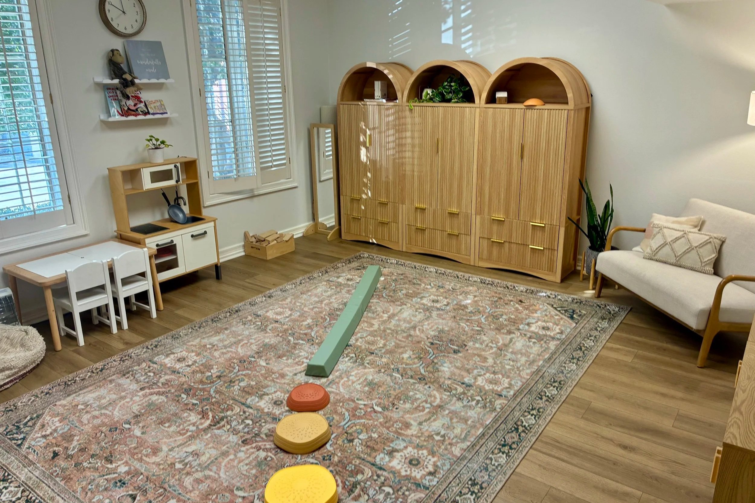 A neutral, calming physical therapy treatment room for children 0-18 year old to address toe walking, oral ties, torticollis, developmental coordination disorder, cerebral palsy, and other movement disorders.