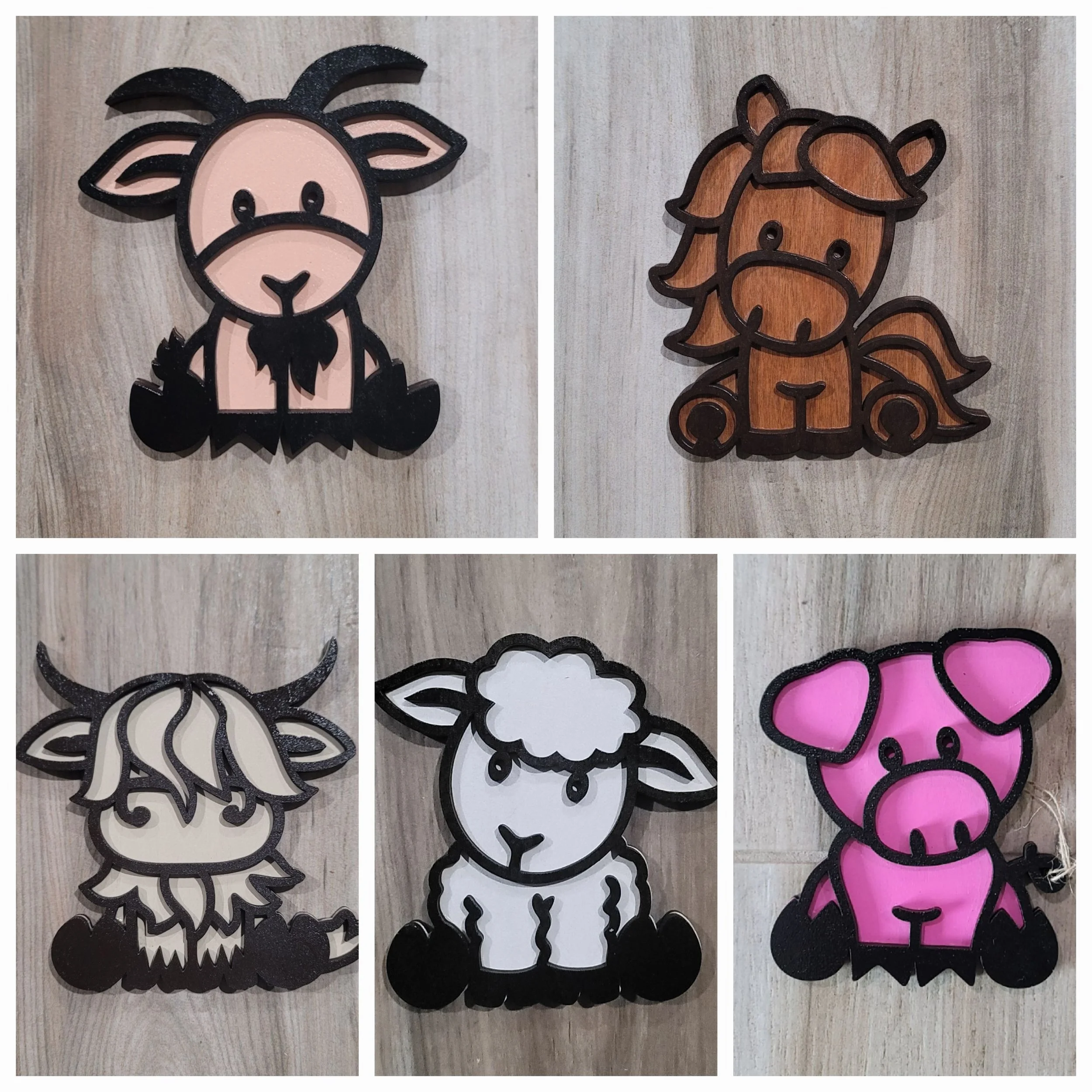 Collection of five cartoon-style animal figurines with black outlines and colored details, including a goat, horse, wolf, sheep, and pig, each on a wooden surface.