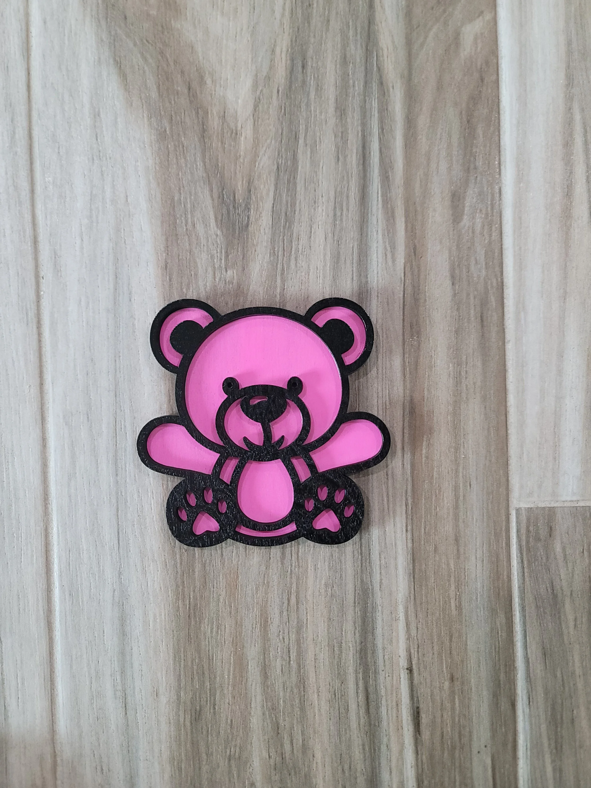 Pink and black teddy bear-shaped 