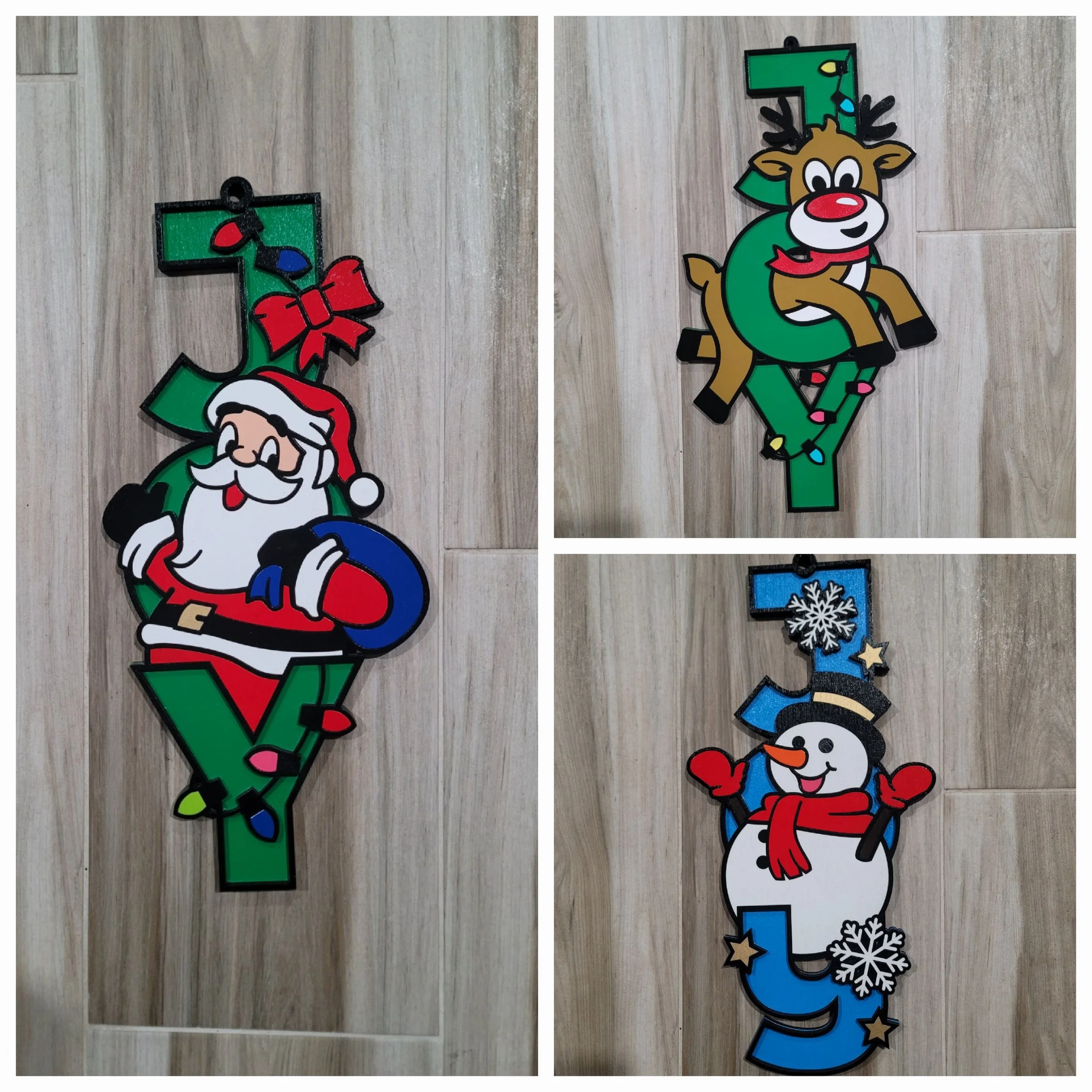 Three Christmas-themed decorated with holiday characters. One features Santa Claus, a reindeer, and a snowman, all decorated with Christmas lights and accessories against a wooden background of JOY.