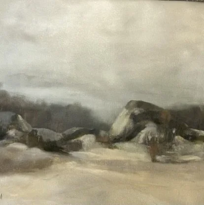 A landscape painting of rocks and a cloudy sky.
