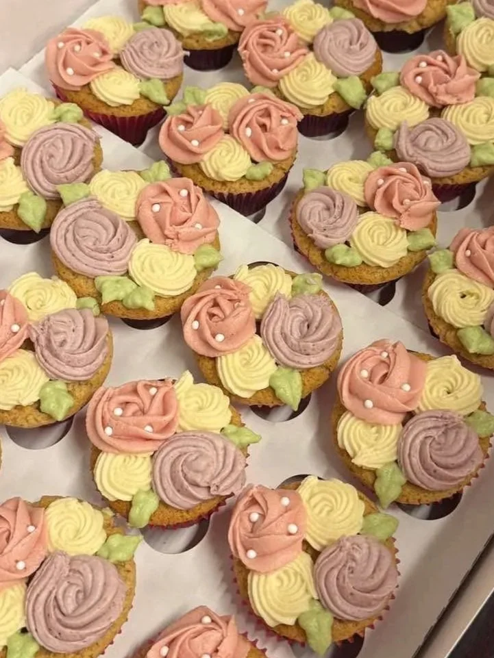 Floral yellow cake cupcakes with white chocolate buttercream, filled with raspberry preserves
