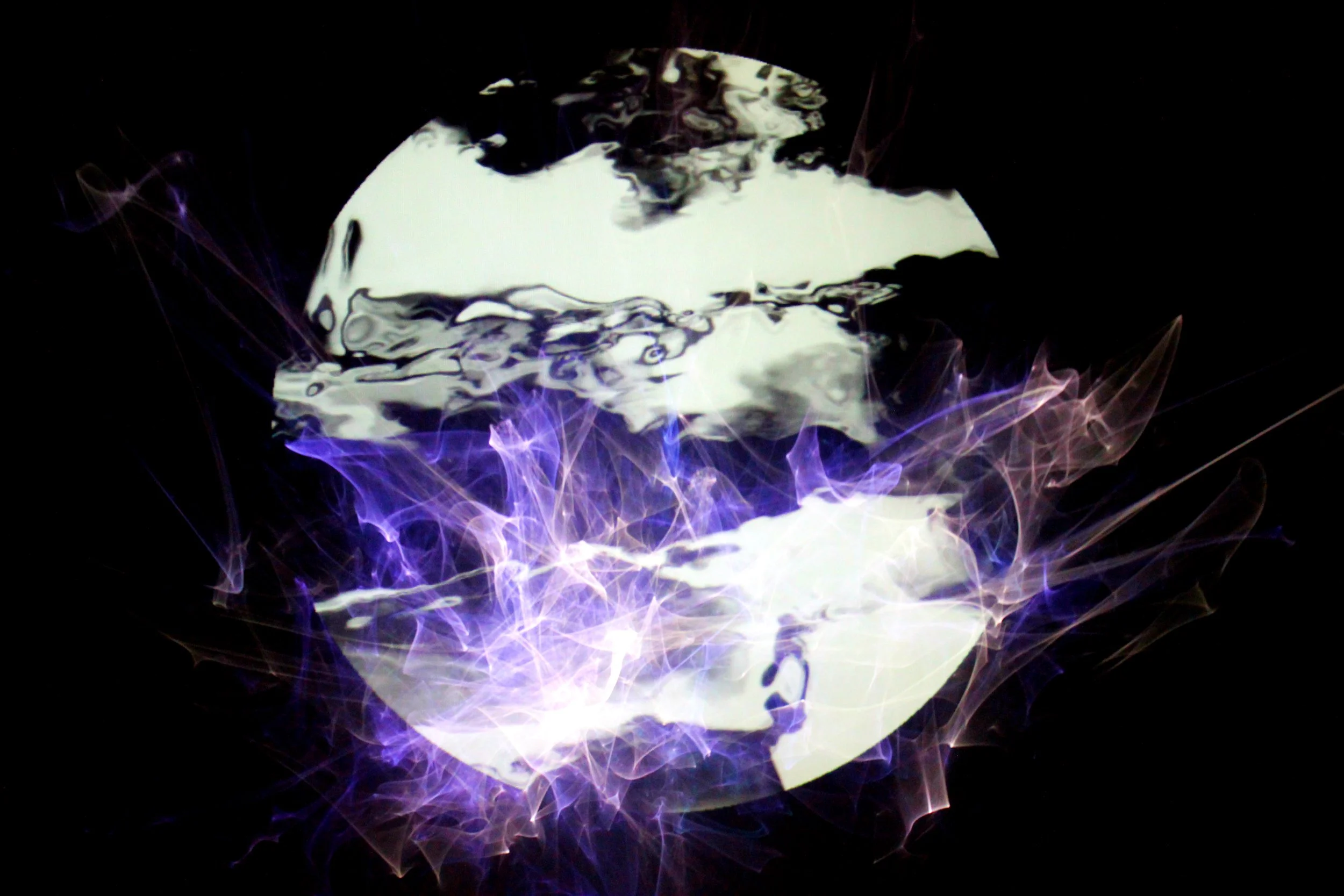 A glowing, abstract depiction of the moon with purple and white lightning-like effects around it, set against a black background.