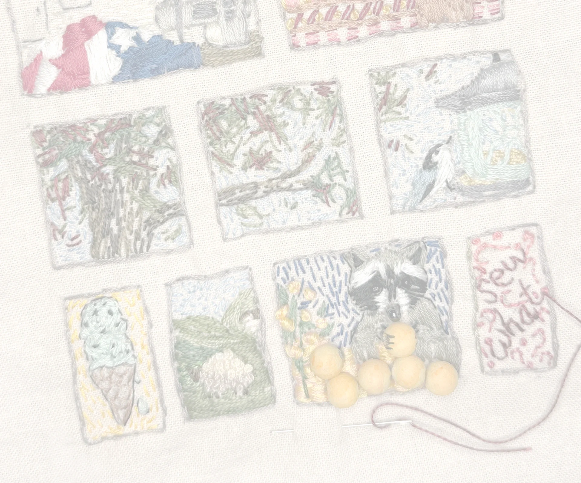 Close-up of embroidered stitch journal panels, showing small nature scenes and a racoon with peaches.