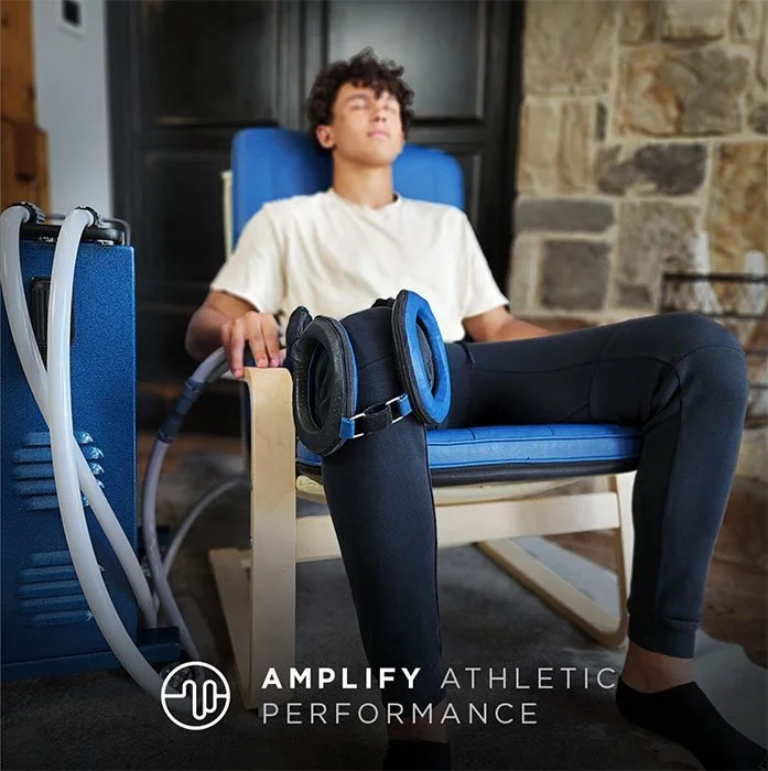 Young man sitting in a Pulse chair receives PEMF therapy.