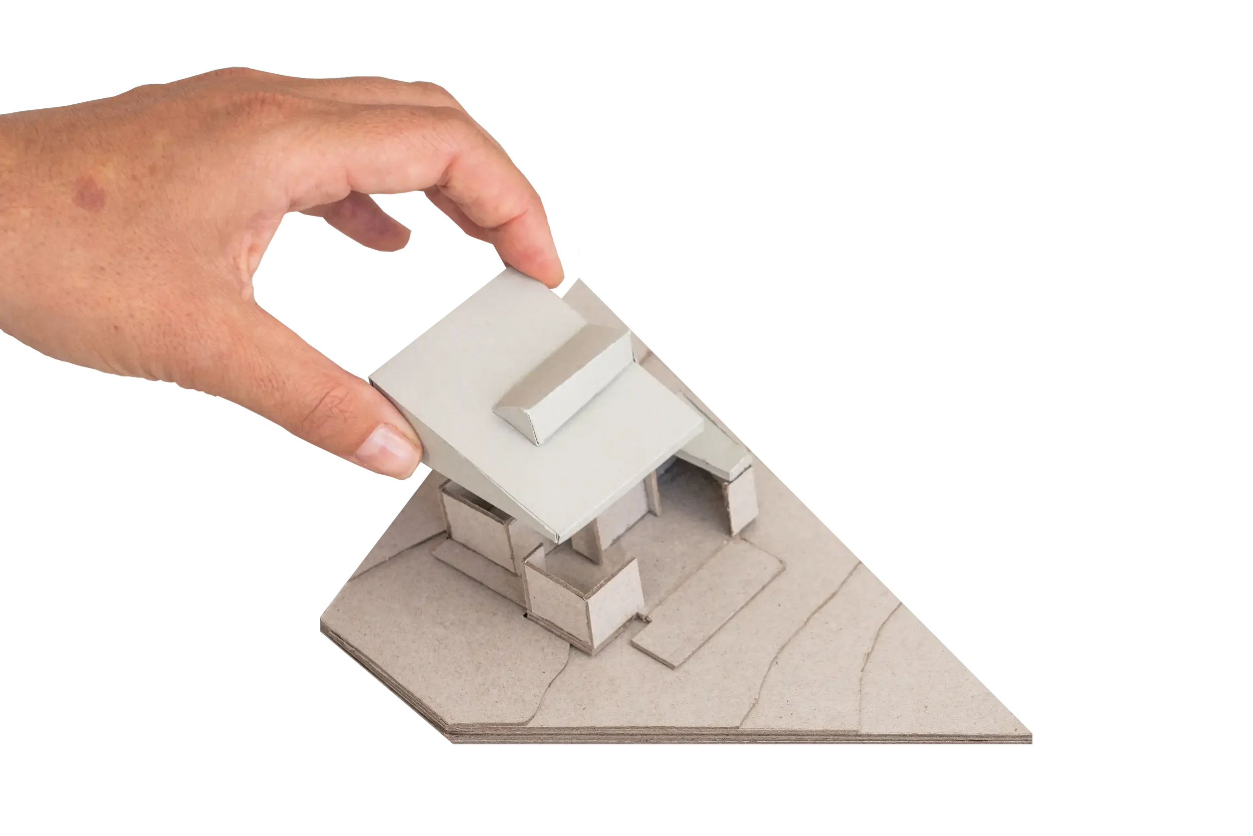 A scale architectural concept model of Lou’s House in Adamstown Heights by Muci. A hand is lifting up a large wedge shaped roof to reveal internal planning.