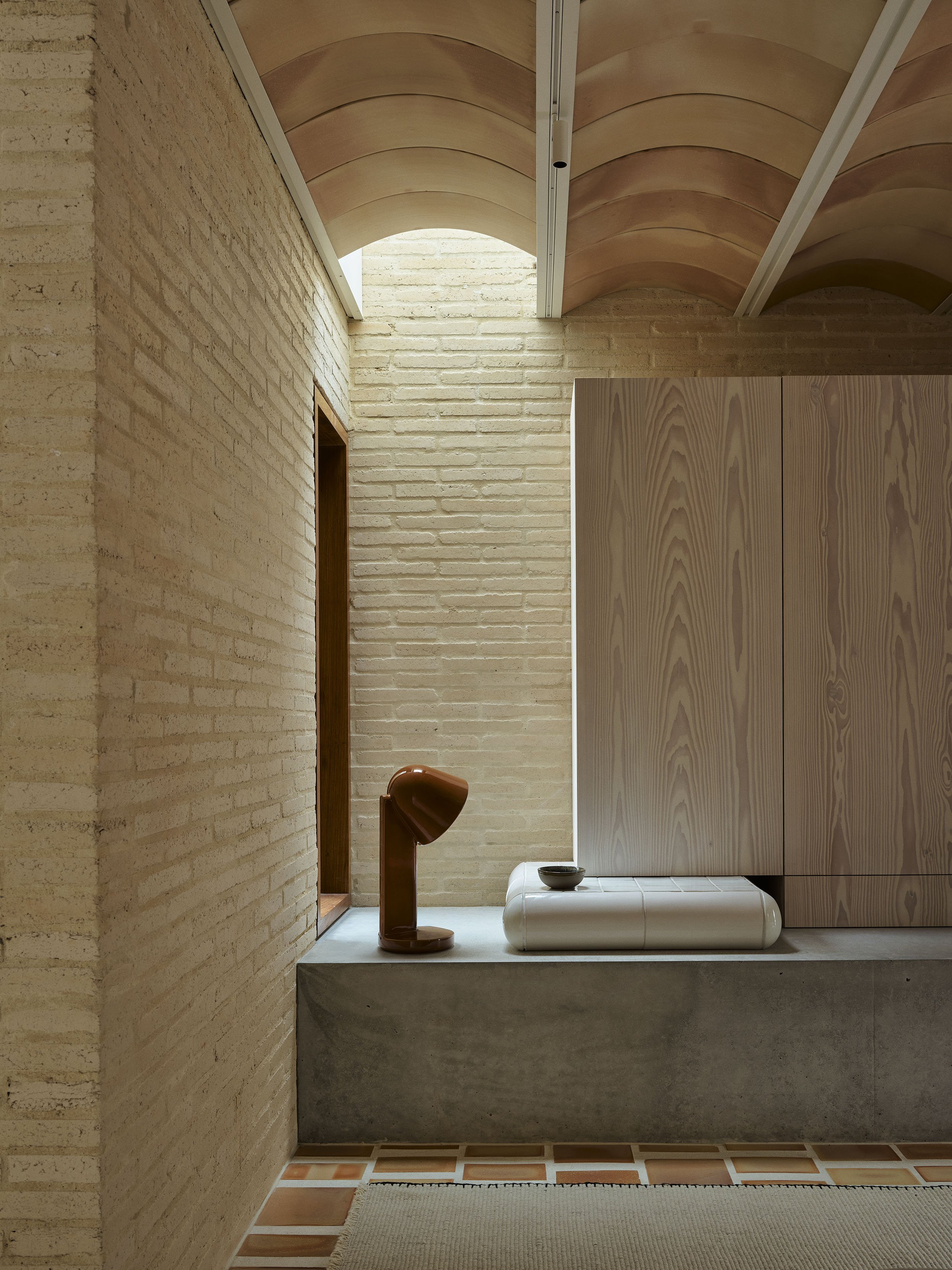 Skylight detail in the lounge room of Sydney terrace renovation by Muci architects. Also featuring tiled plinth and flos ceramic lamp.
