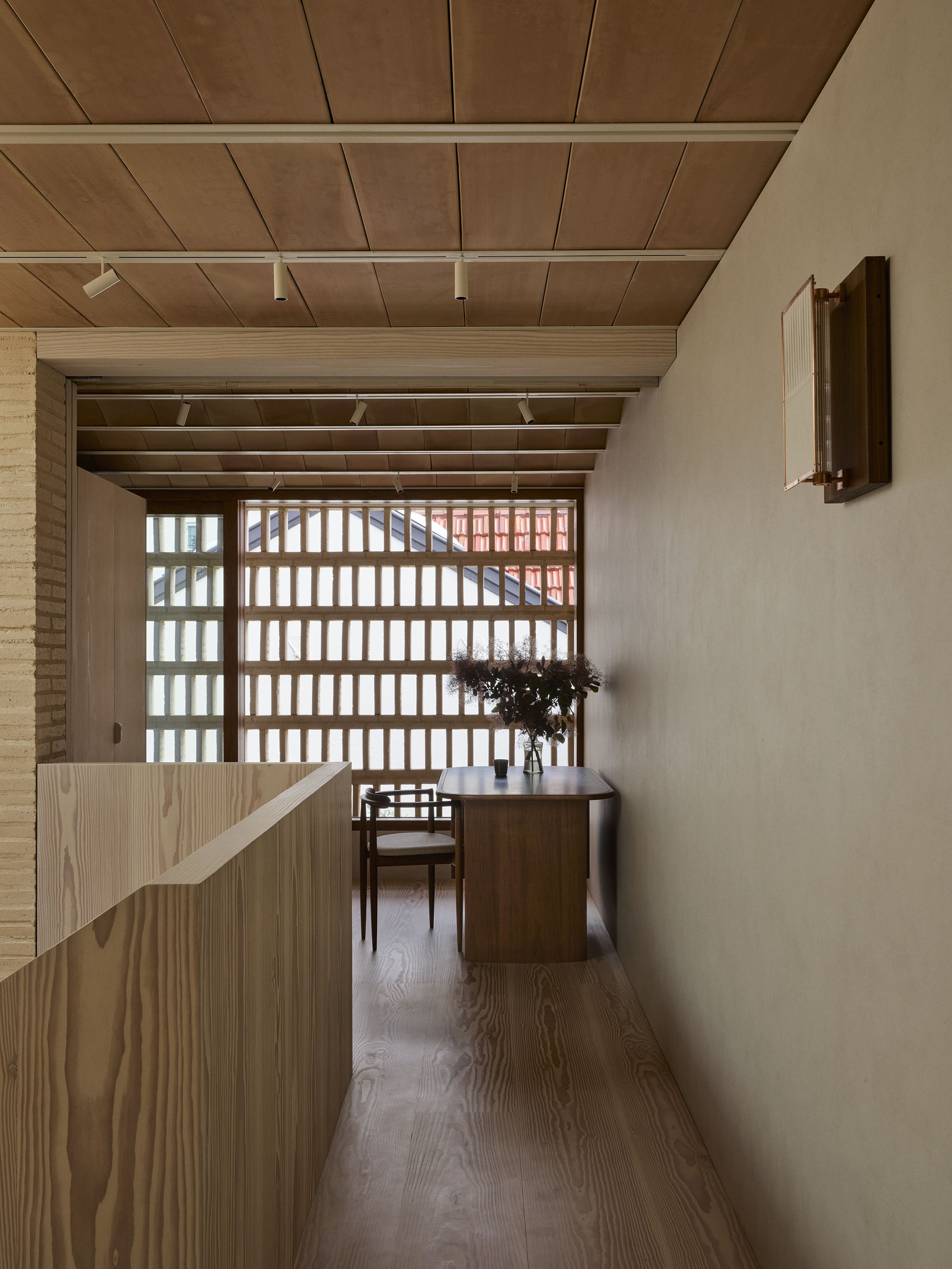 An eastern edition desk and jungle kwon wall light in the Sydney terrace architect renovation, clay house, by Muci architects.
