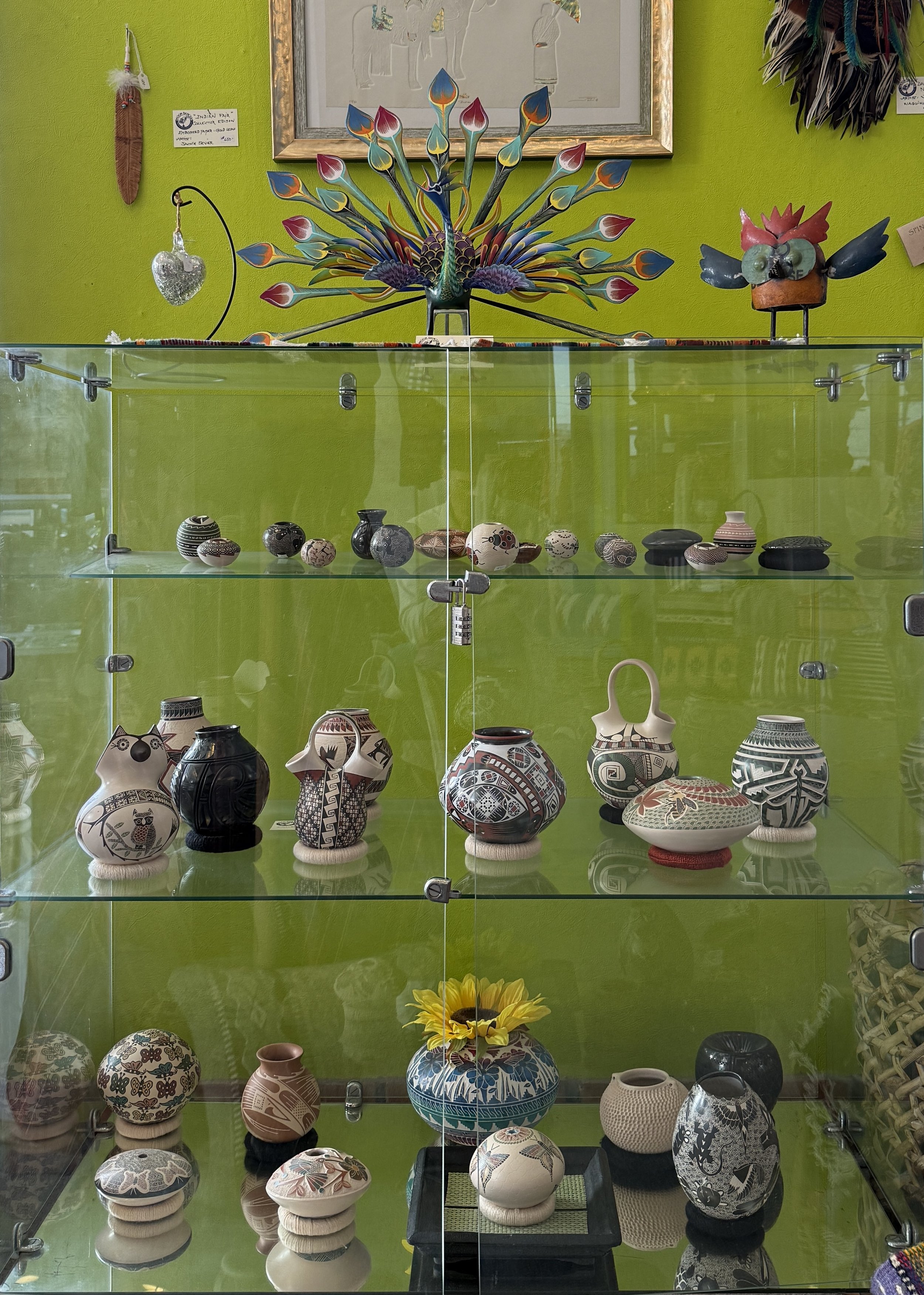 Case of handmade pottery for home use and display.