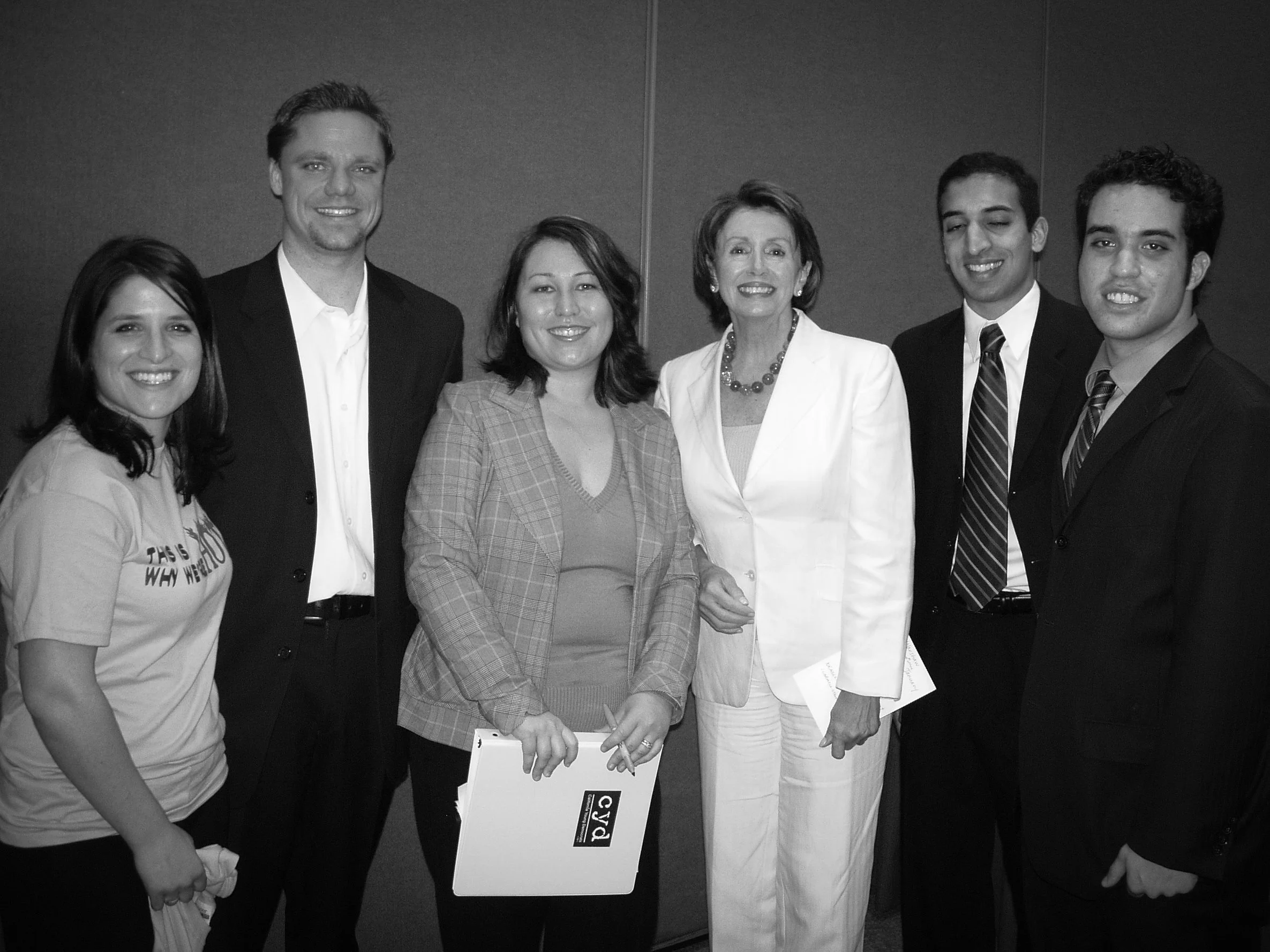 Stacy Berger standing with a group including Nancy Pelosi