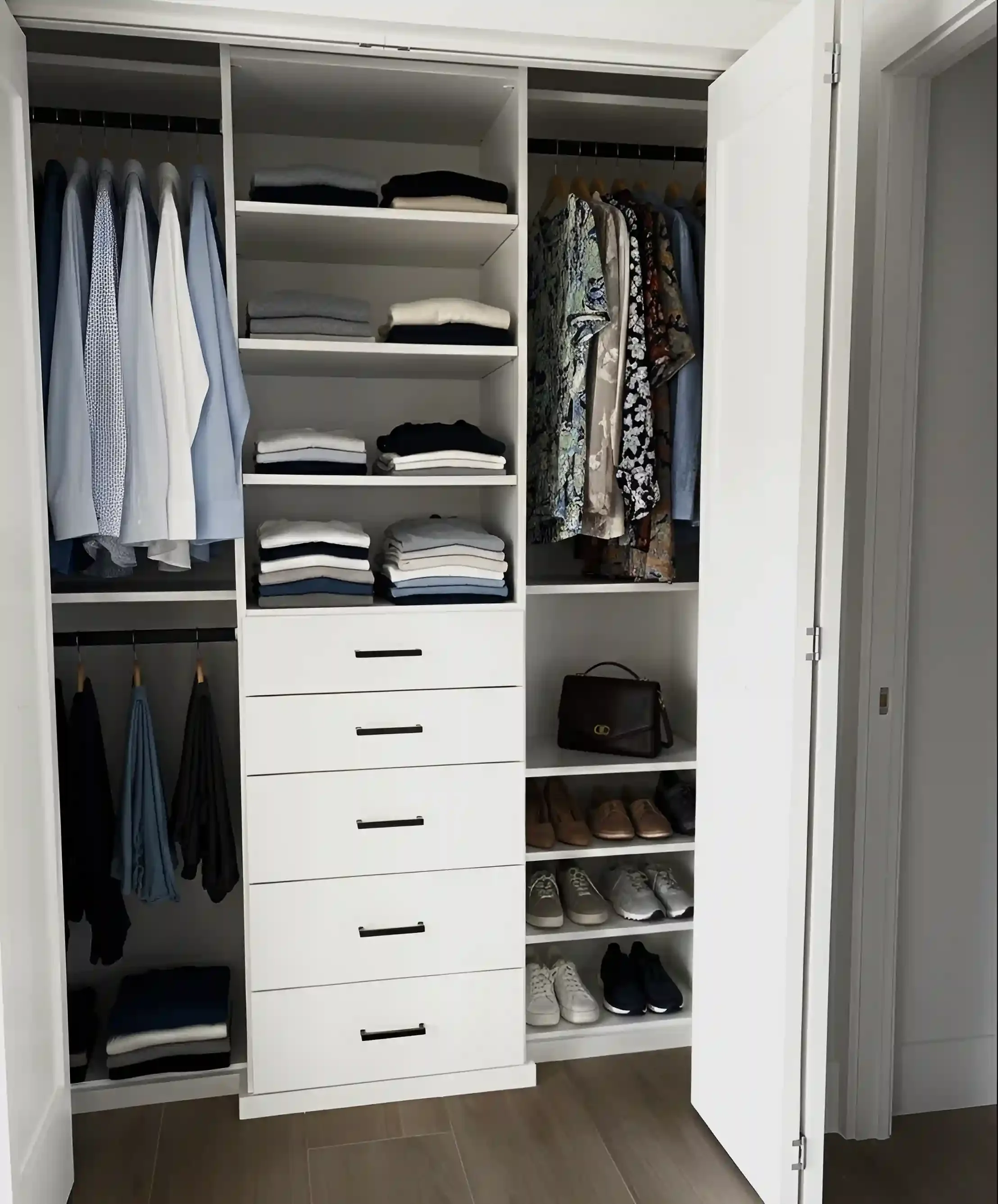 Open closet with organized clothing, shoes, and accessories.
