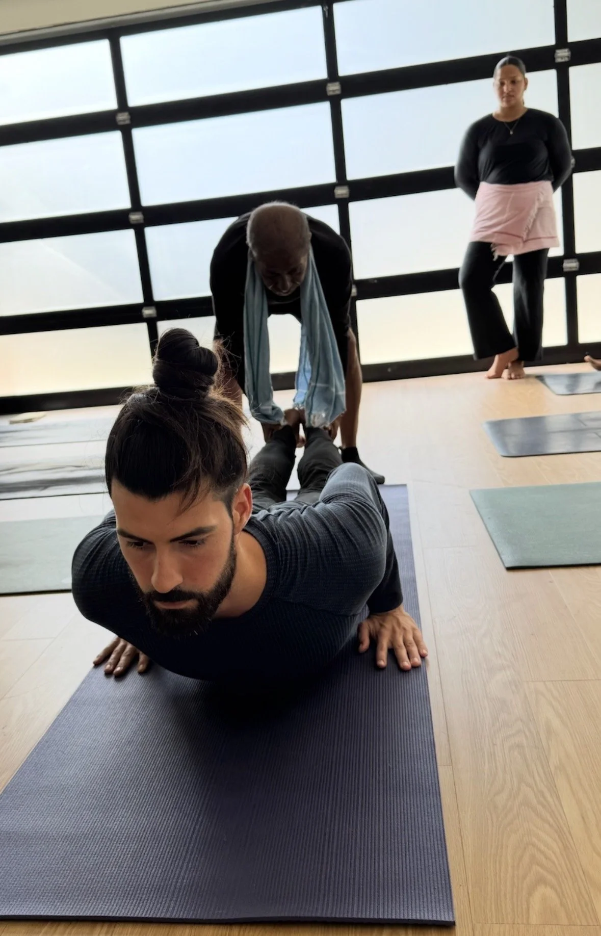 Manju Pattabhi Jois showing yoga therapy assist on Caio during training