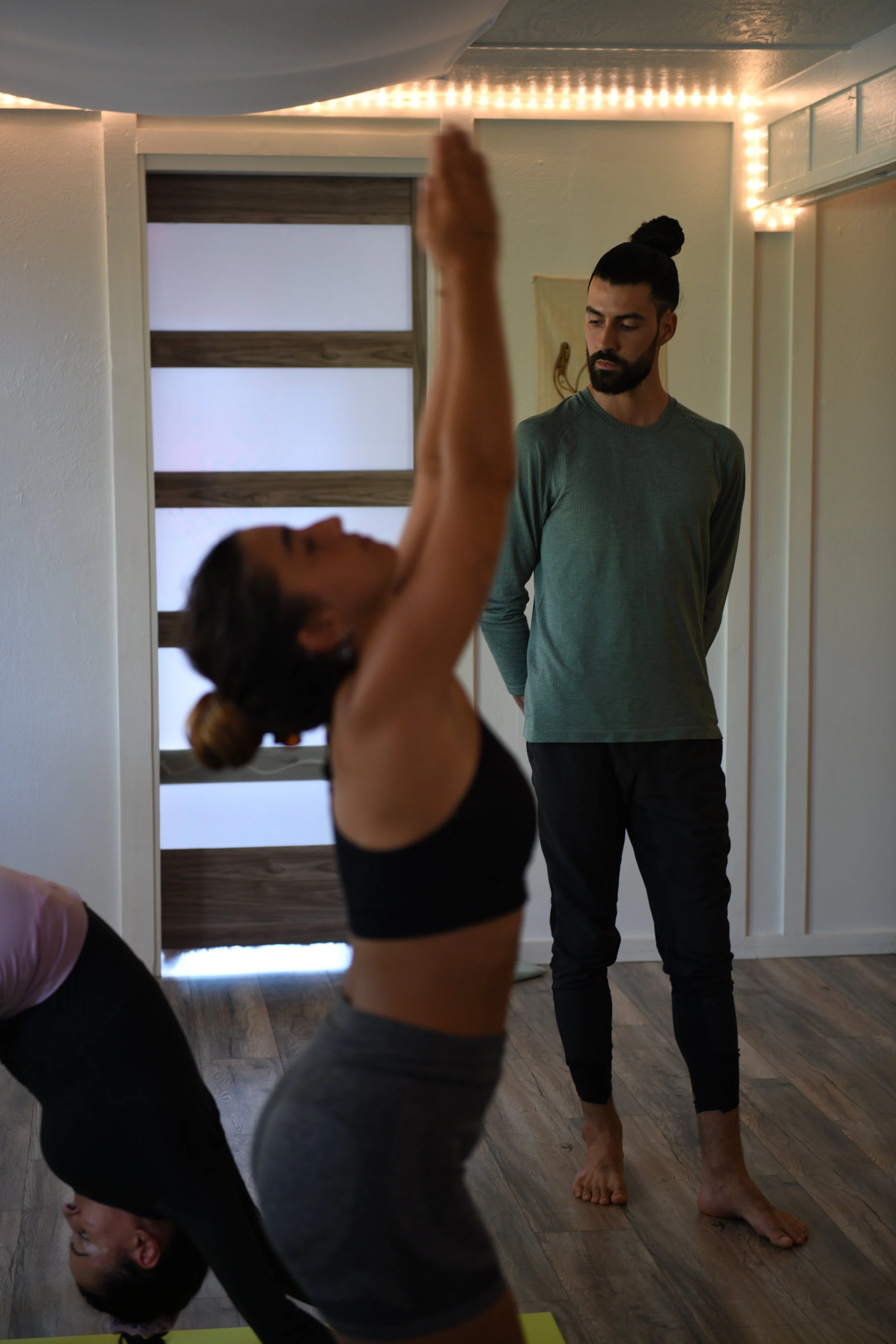 Caio observing students during Ashtanga Yoga Mysore practice in Haiku, Hawaii
