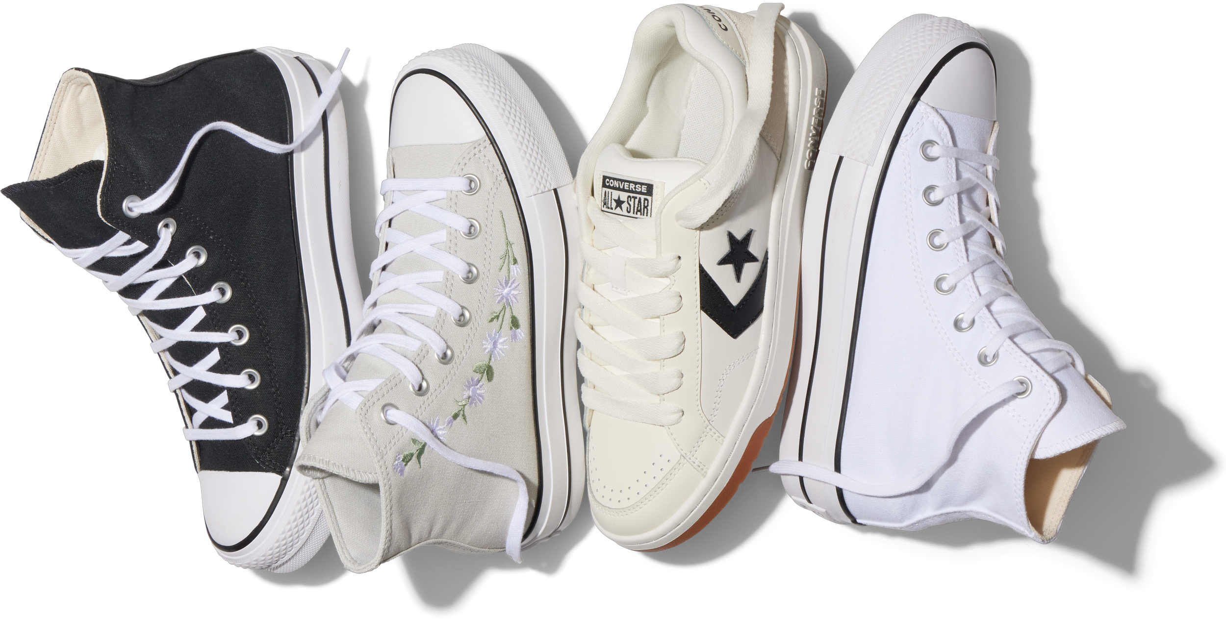 Four different styles of Converse sneakers on a black background, including high-top, embroidered, classic, and on-trend white sneakers.