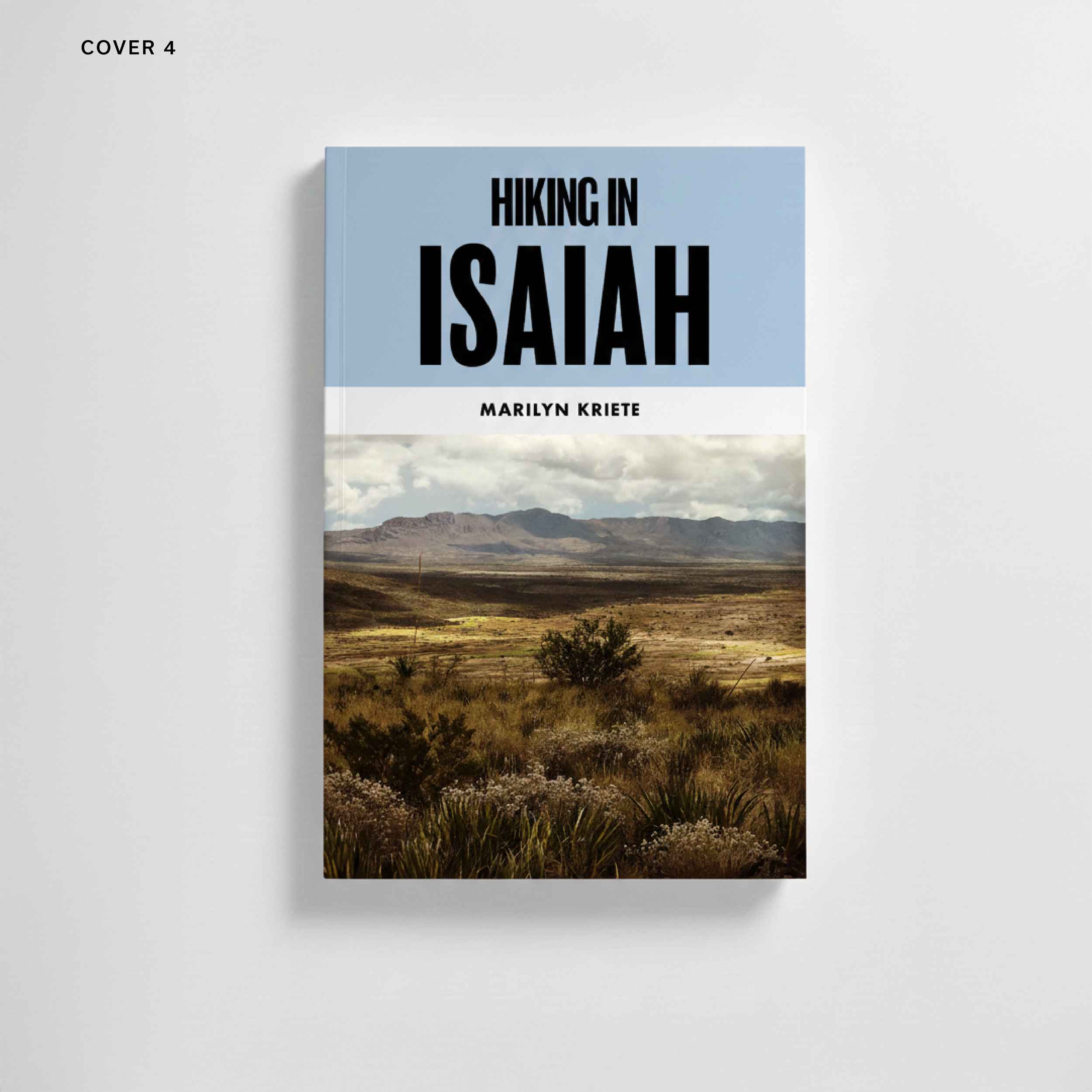 Book titled 'Hiking in Isaiah' by Marilyn Kriete, featuring a landscape with desert vegetation and mountains under a cloudy sky.