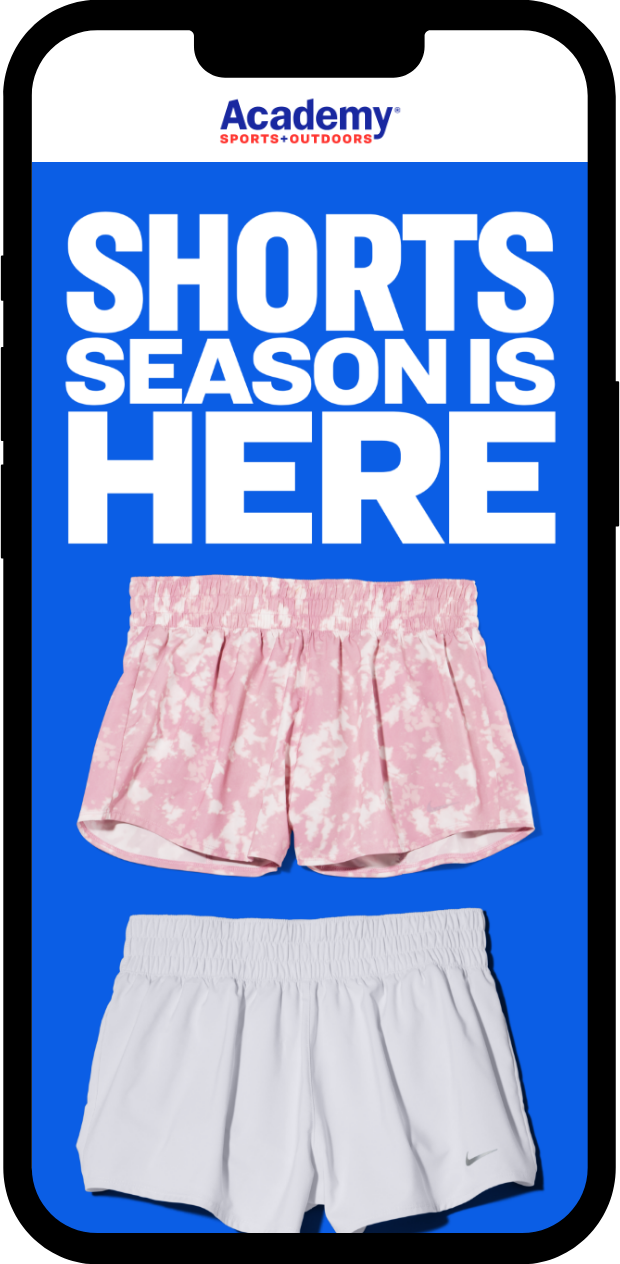Advertisement for shorts featuring two pairs of athletic shorts, one pink with a white pattern and one plain white with a Nike logo, with a banner stating "Shorts season is here"