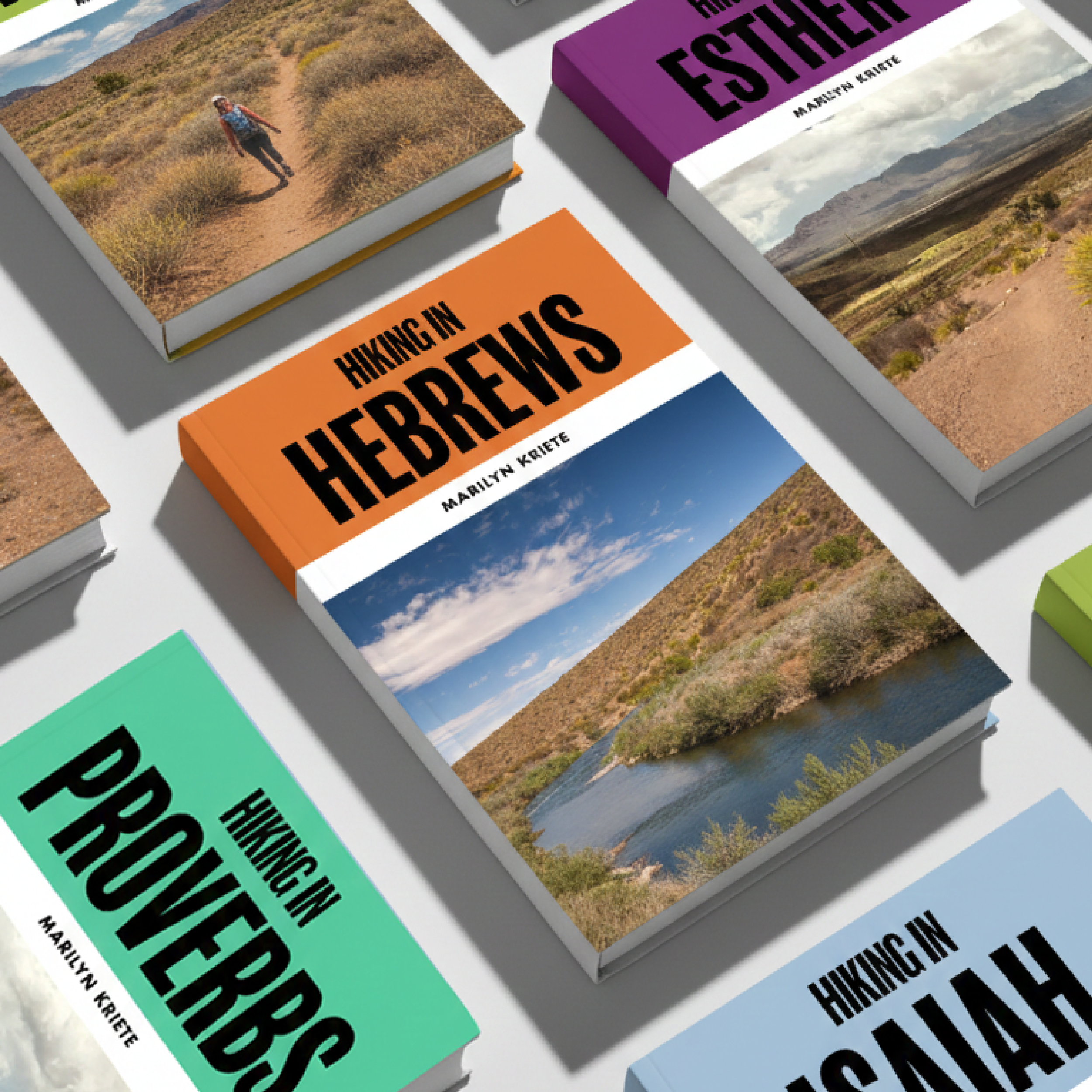 Books titled "Hiking in Hebrews" by Marilyn Kriete with colorful covers, each featuring outdoor landscape photographs and bold black text.