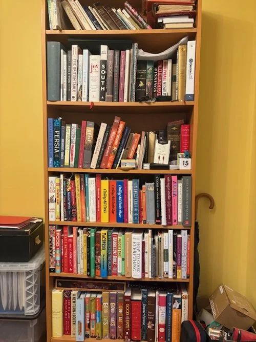 A six-shelf bookshelf. It's almost full, and it's around 90% cookbooks.