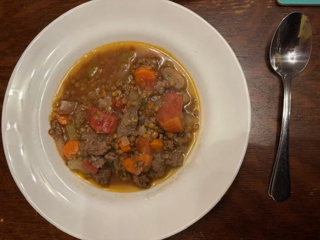 a bowl of beef-lentil soup