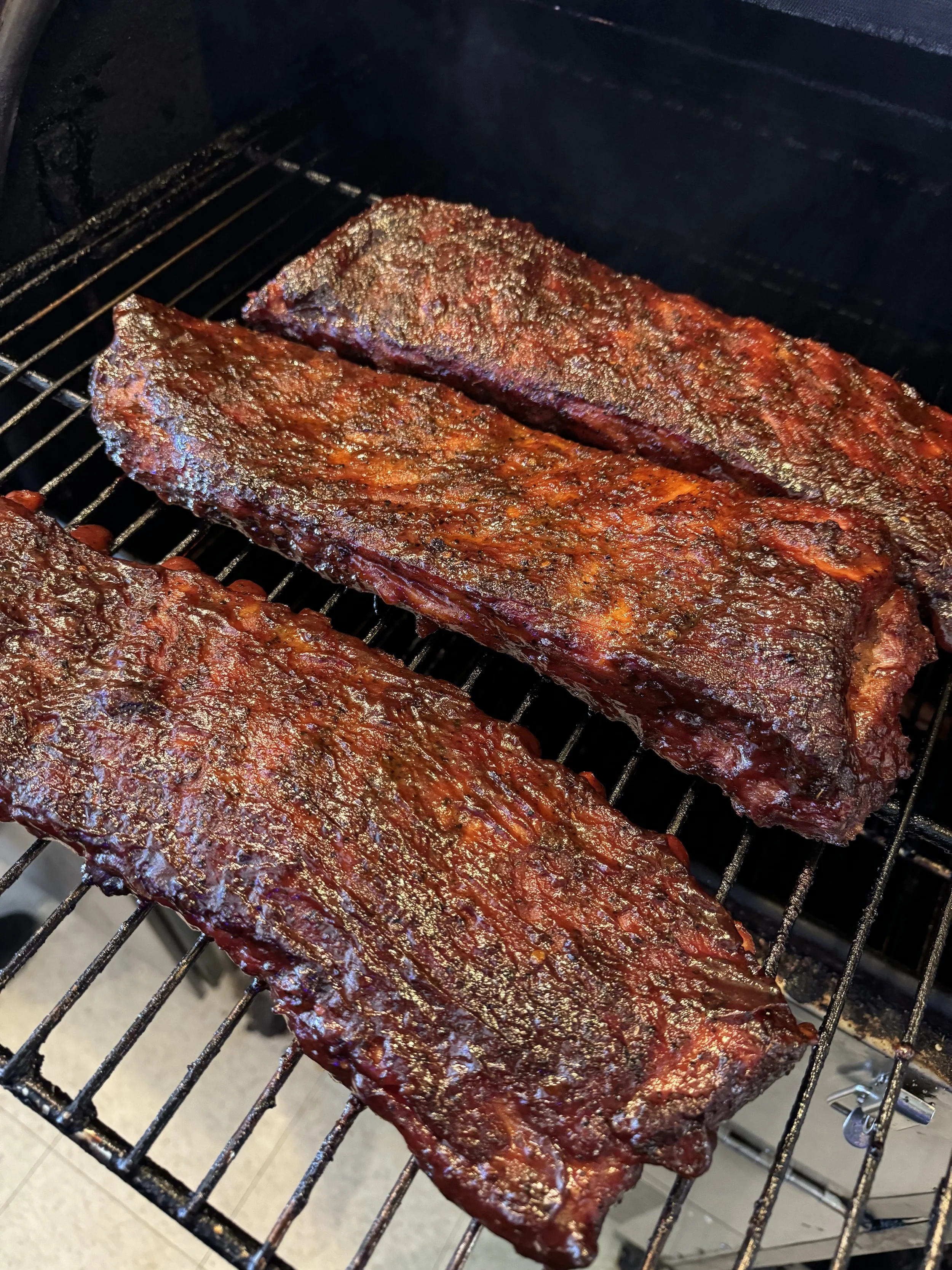 American Duroc Pork Spare Ribs Slow-smoked pork spare ribs cooked low and slow.