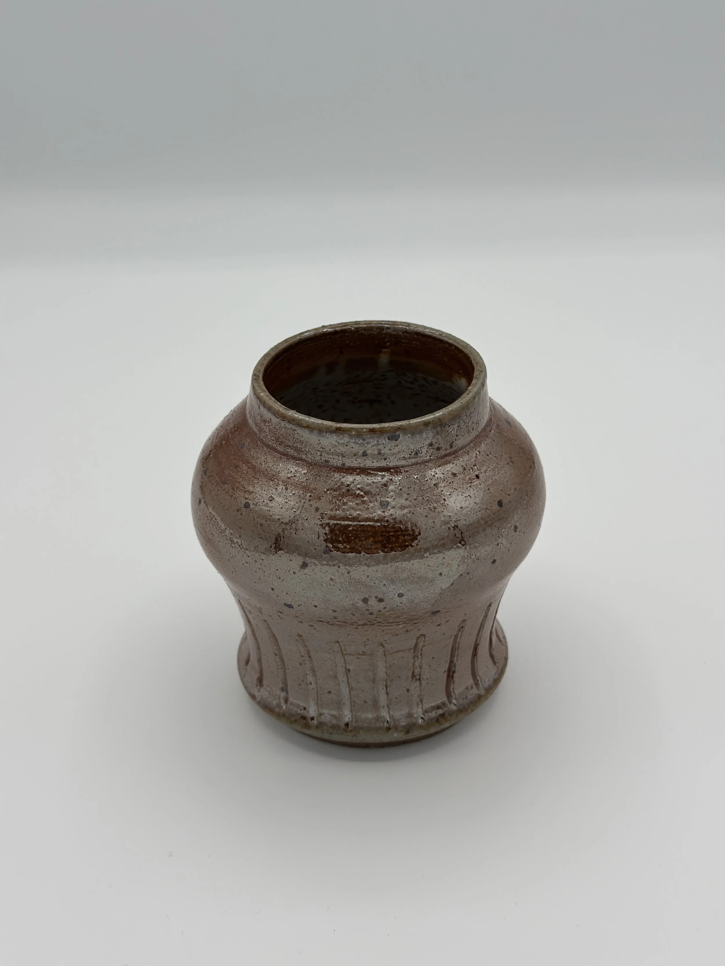 metallic soda fired shaped carved vase