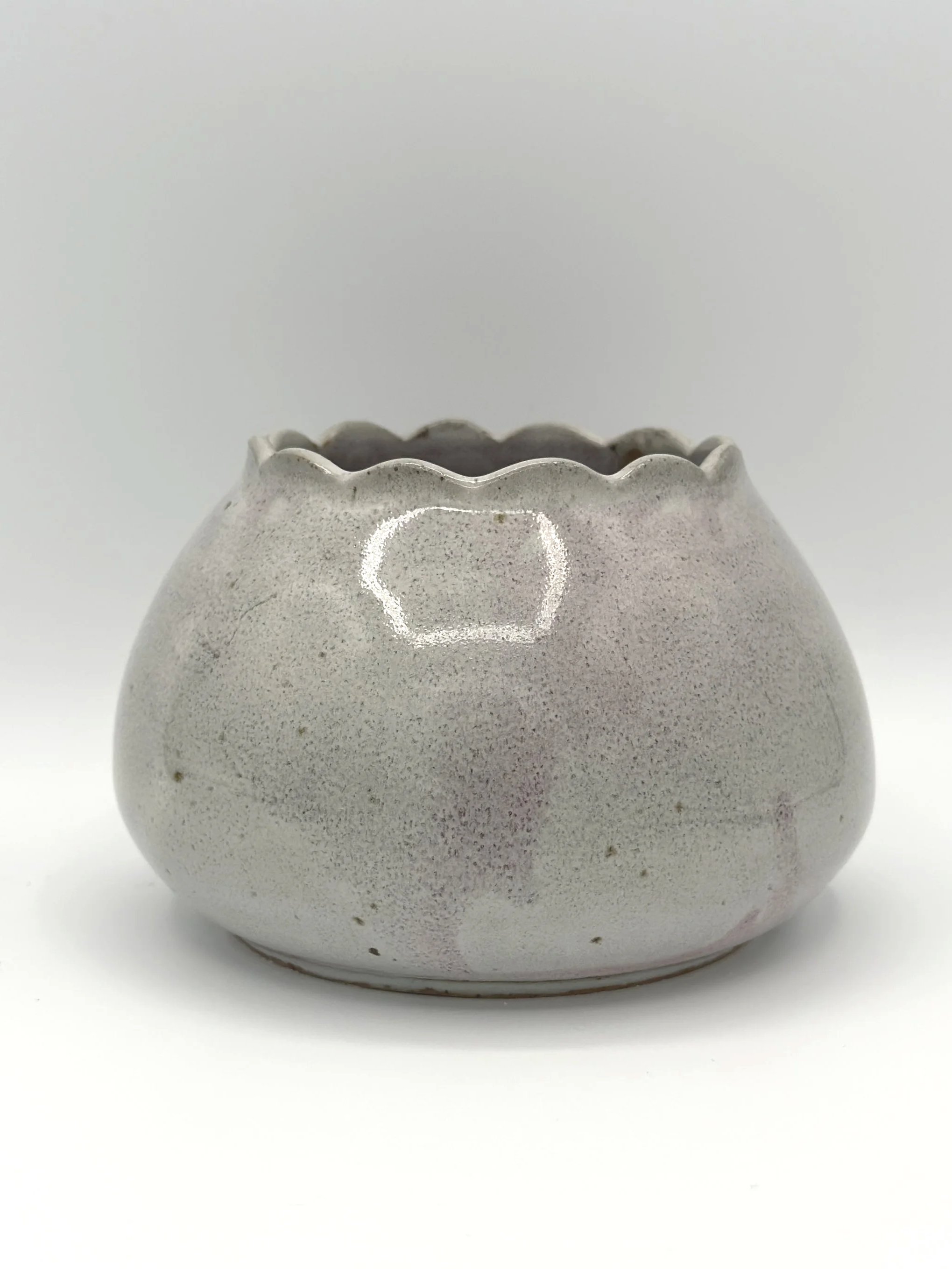 handmade stoneware ceramic bud vase in glossy lavender, mauve, pink and grey glaze with scalloped rims