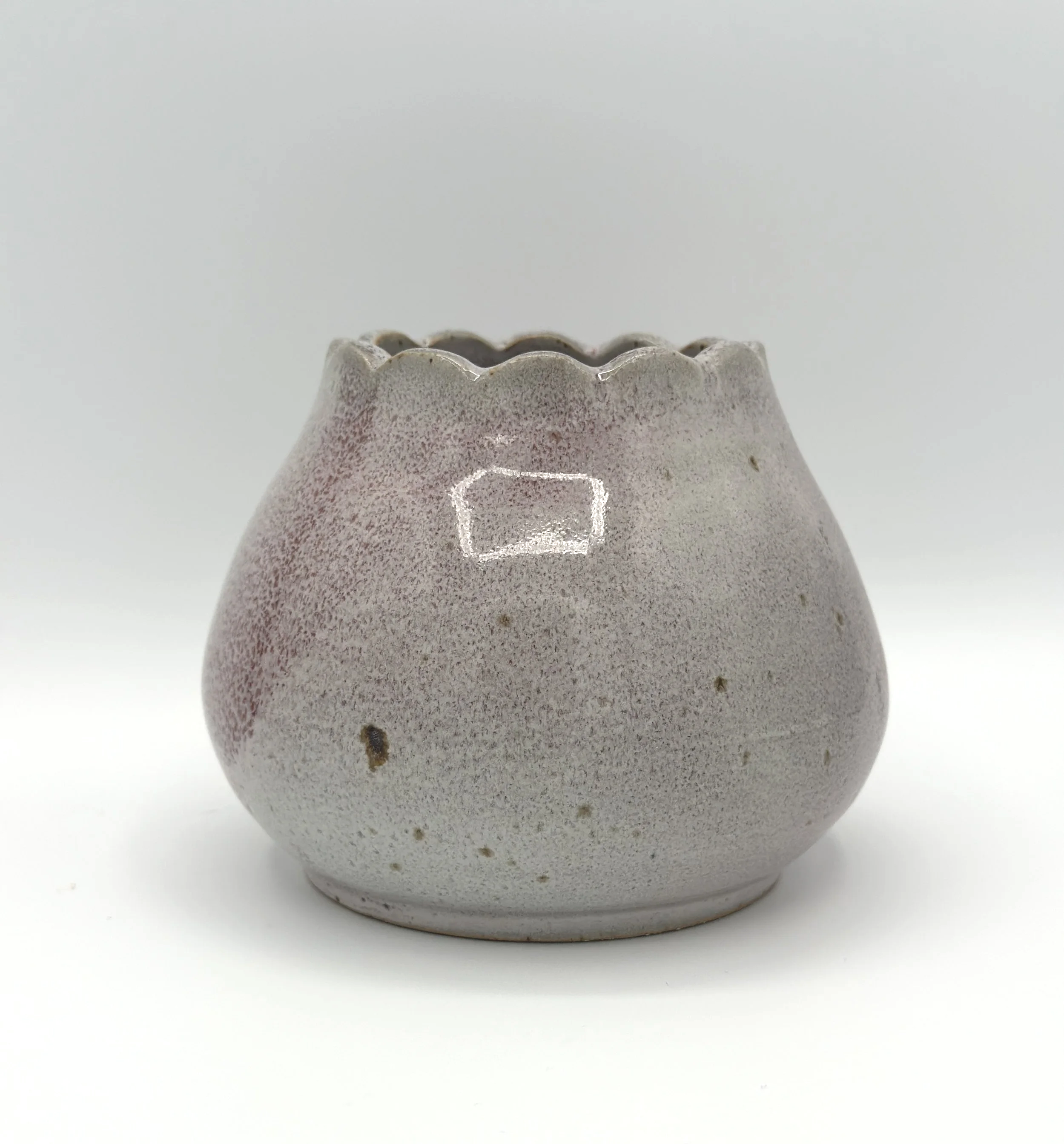 handmade stoneware ceramic bud vase in glossy lavender, mauve, pink and grey glaze with scalloped rims