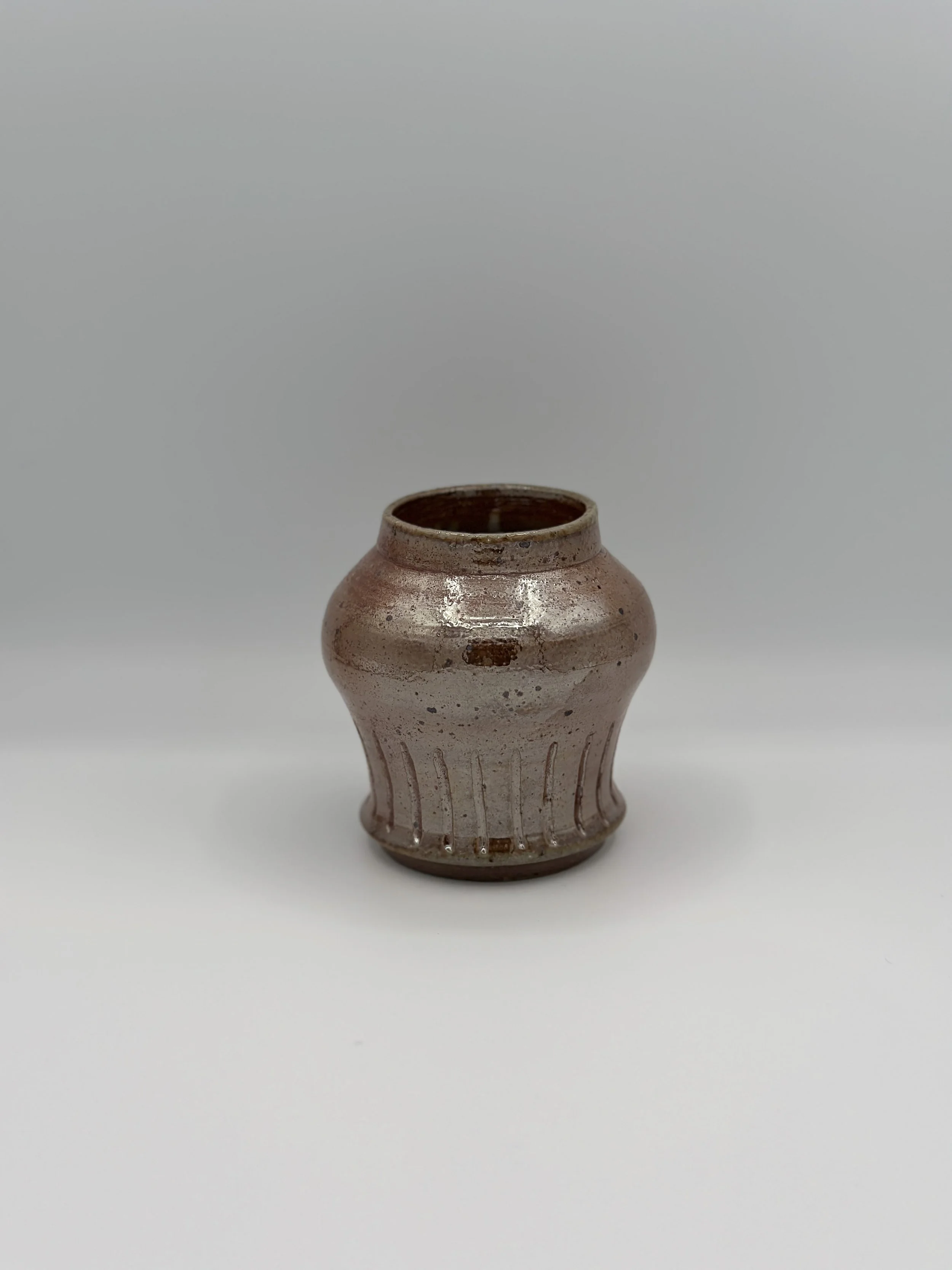 metallic soda fired shaped carved vase