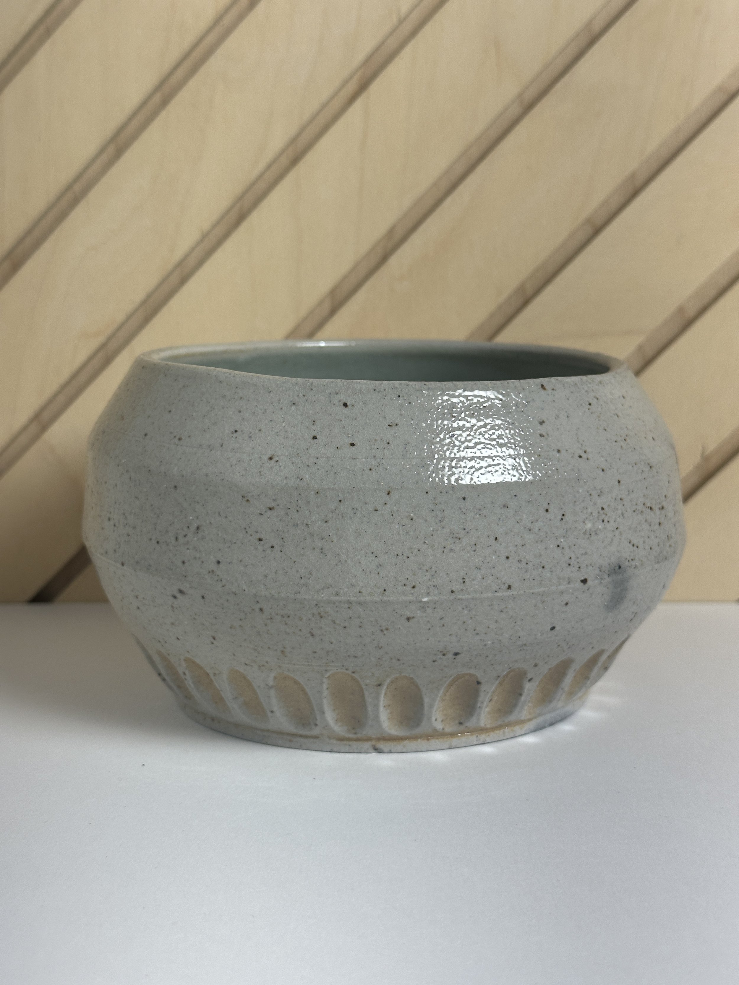 angled carved soda fired bowl