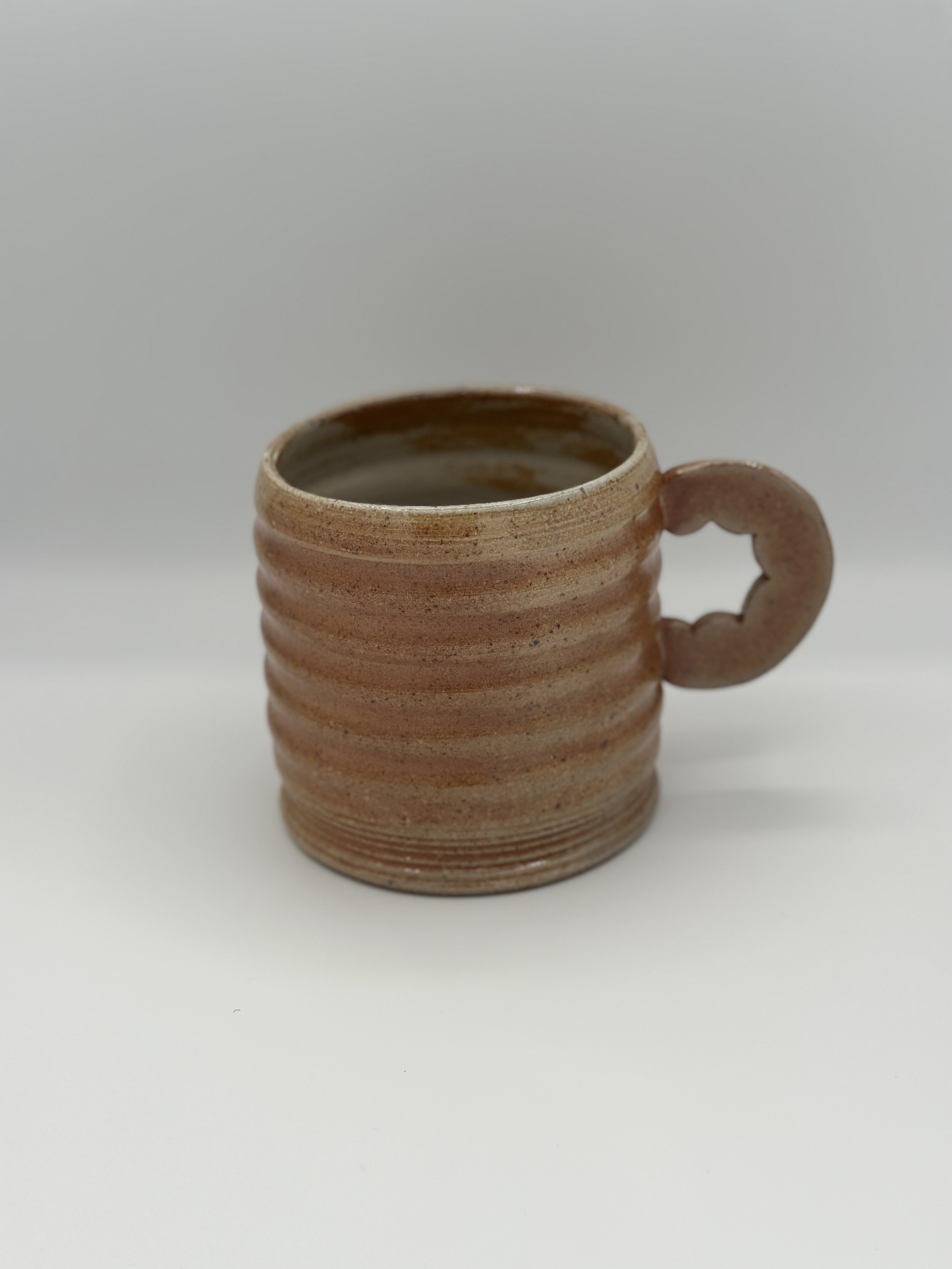 A big mug with ripples and a hand made graphical handle