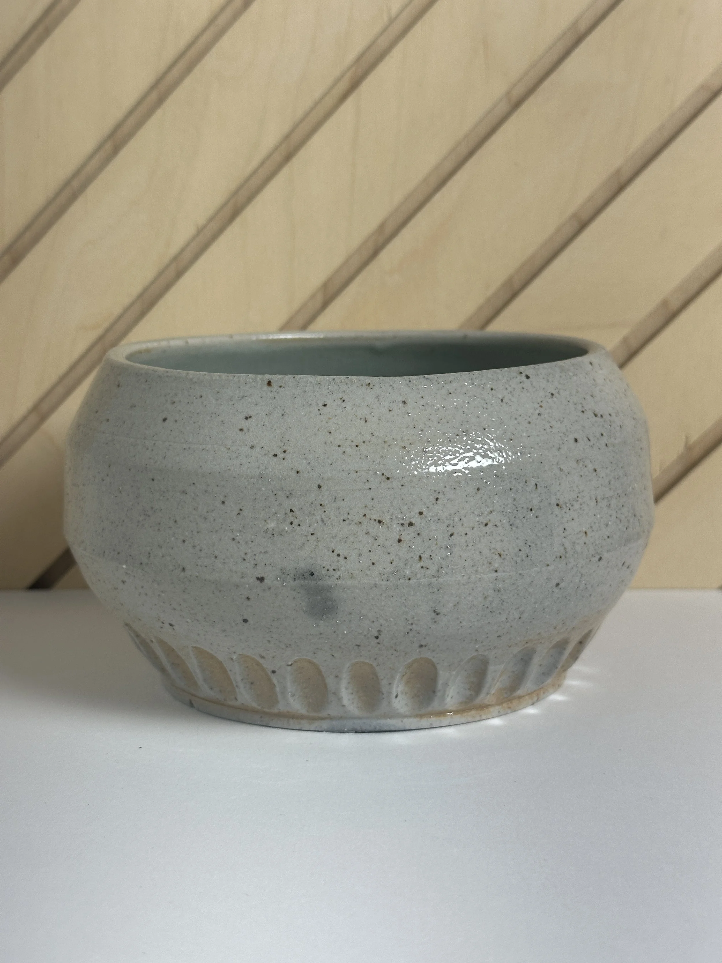 angled carved soda fired bowl