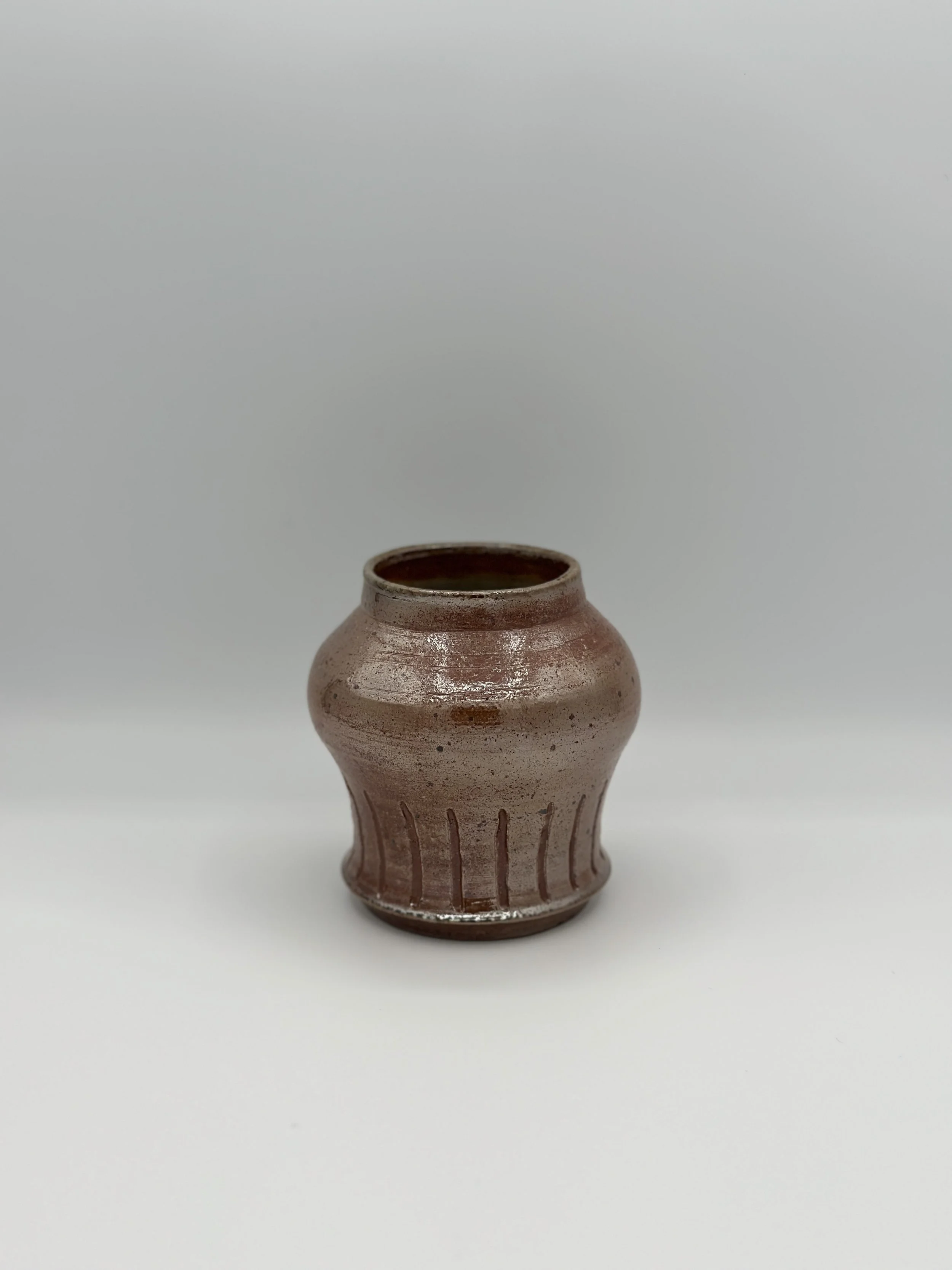 metallic soda fired shaped carved vase