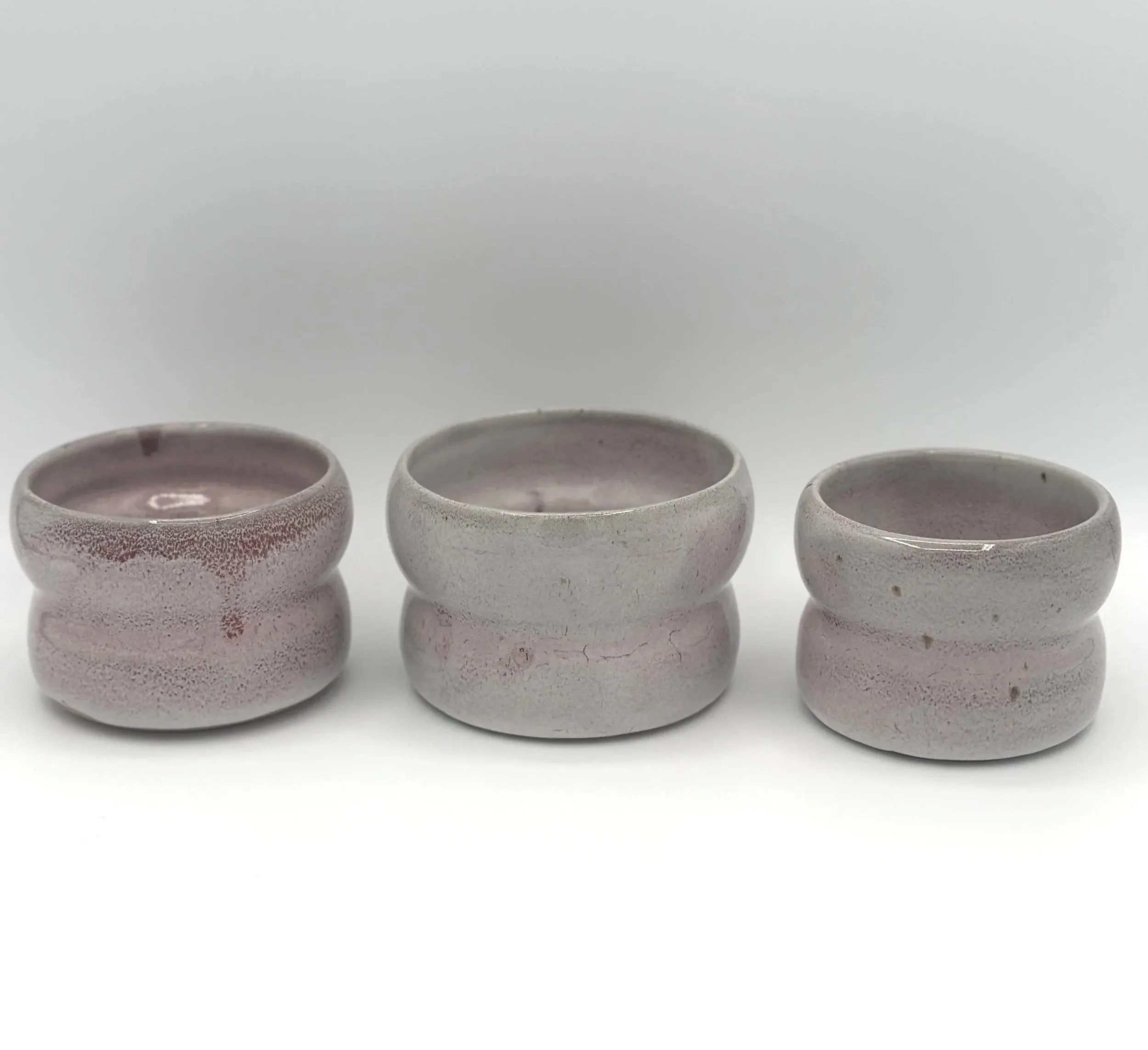 3 little handmade ceramic bubble tumblers drippy mauve pink lavender grey glossy glaze on a 2 wave bubble small tumbler planter handmade ceramics