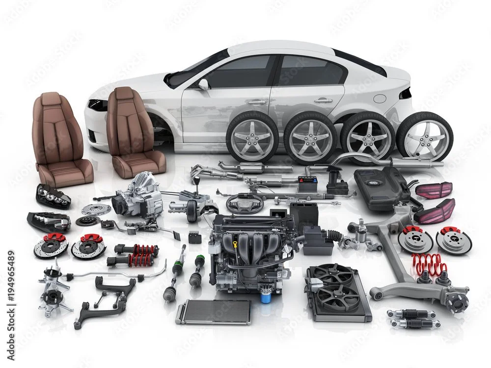 Disassembled parts of a white car including two brown car seats, four wheels, engine, brakes, suspension, and various car components displayed on a white background.