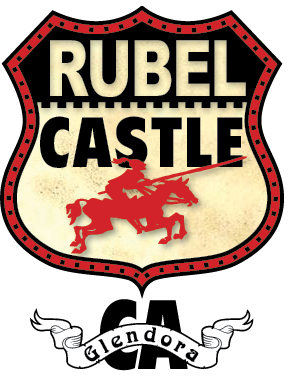 Rubel Castle sign with a red shield outline, the words 'Rubel Castle' in large white and black letters, and a red knight on horseback. A banner below reads 'glendora'.