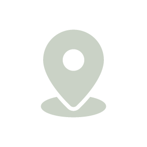 Icon of a map pin located on a flat surface.