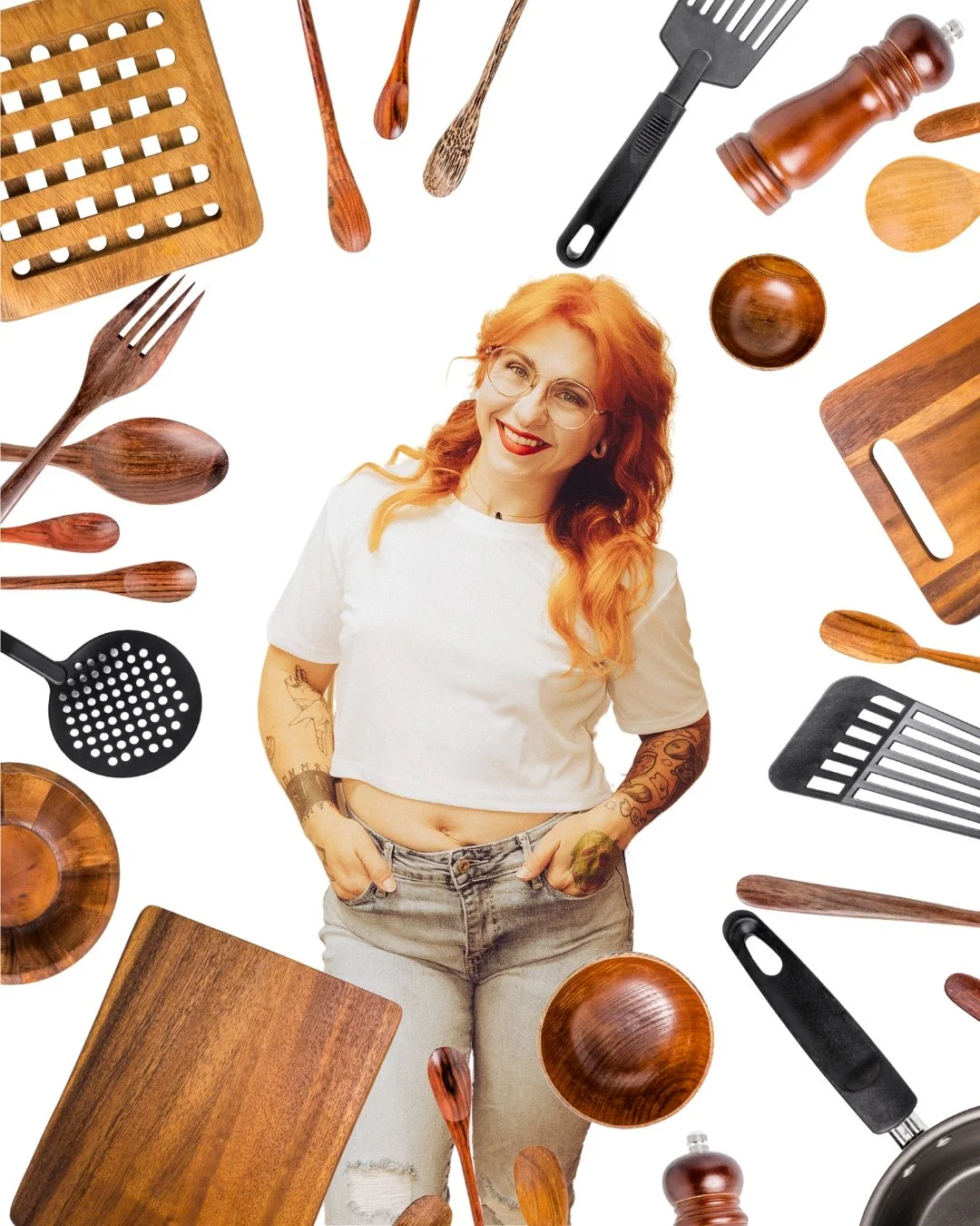 A woman with red hair and glasses smiling, surrounded by wooden kitchen utensils and cutting boards on a white background.