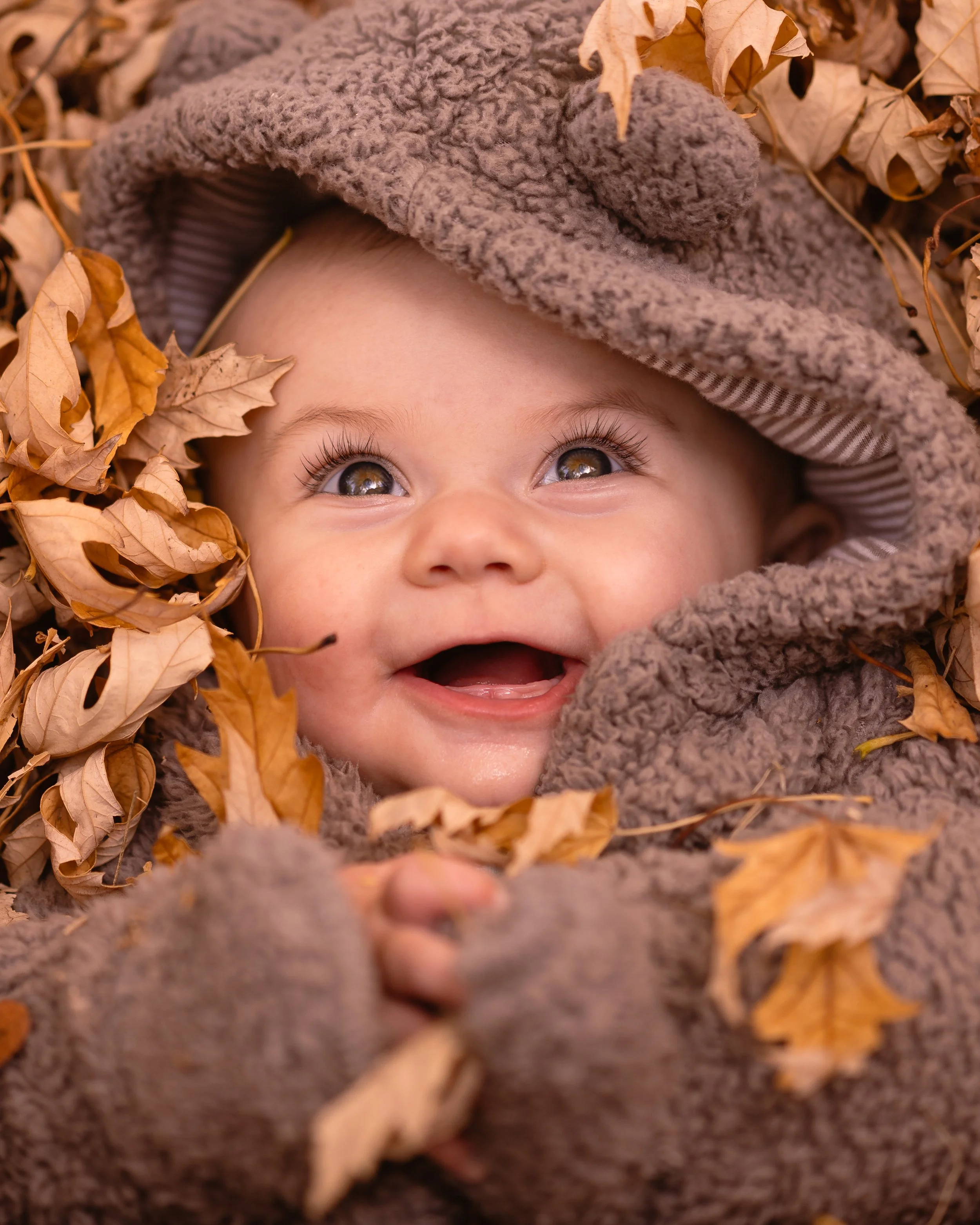 Elowen in leaves portrait crop.jpg
