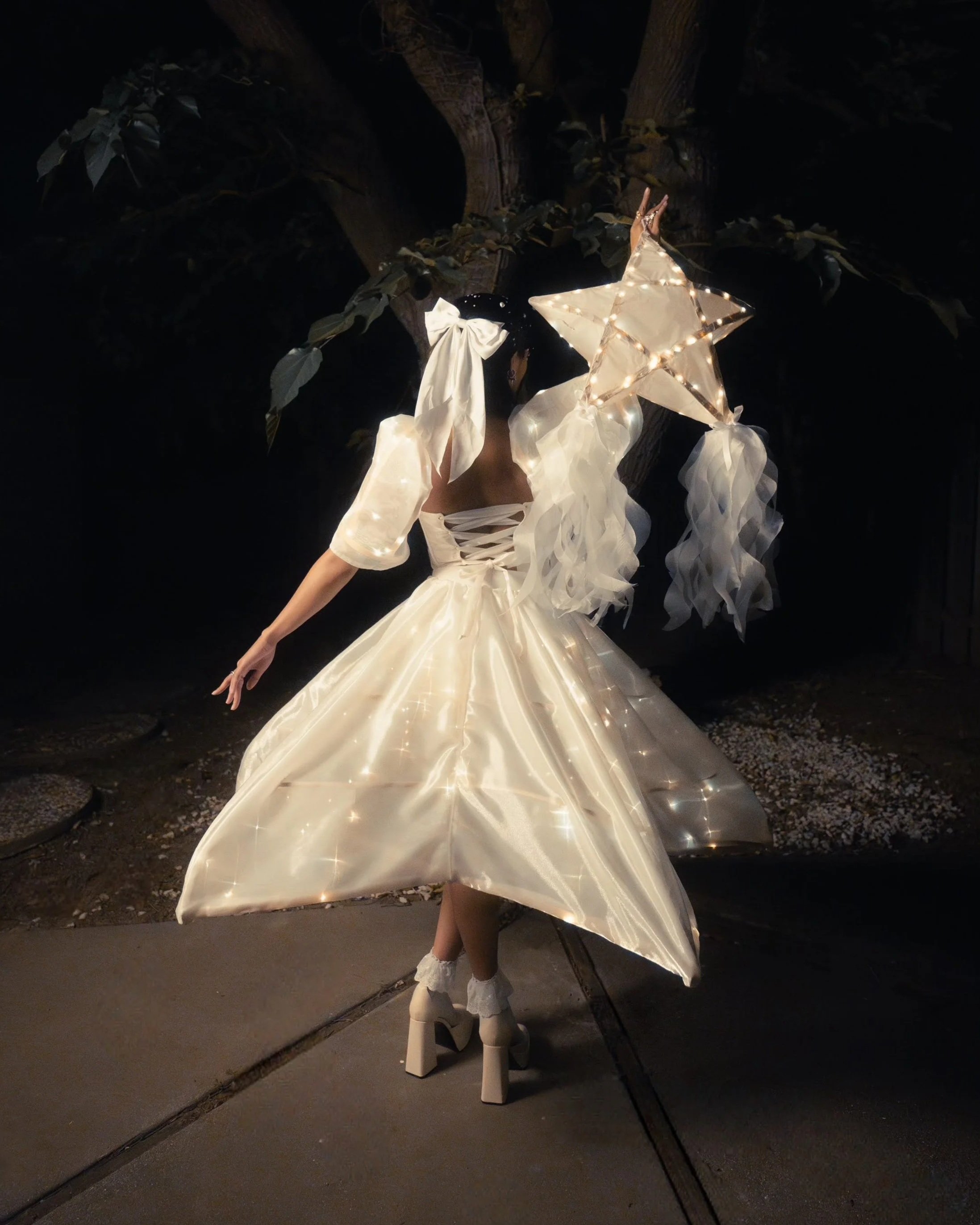   Nag lalakad Na Parol: Walking Lantern  , Textile, wood, string lights, 2025.