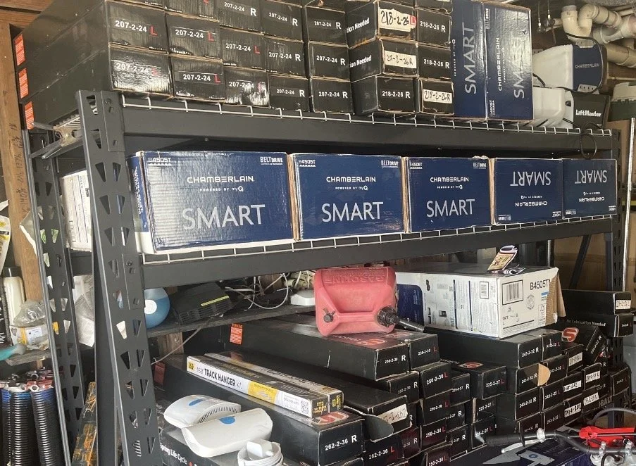 Fully stocked Legacy Garage Door LLC service truck with garage door openers, springs, and repair parts for same-day service in Houston Texas.