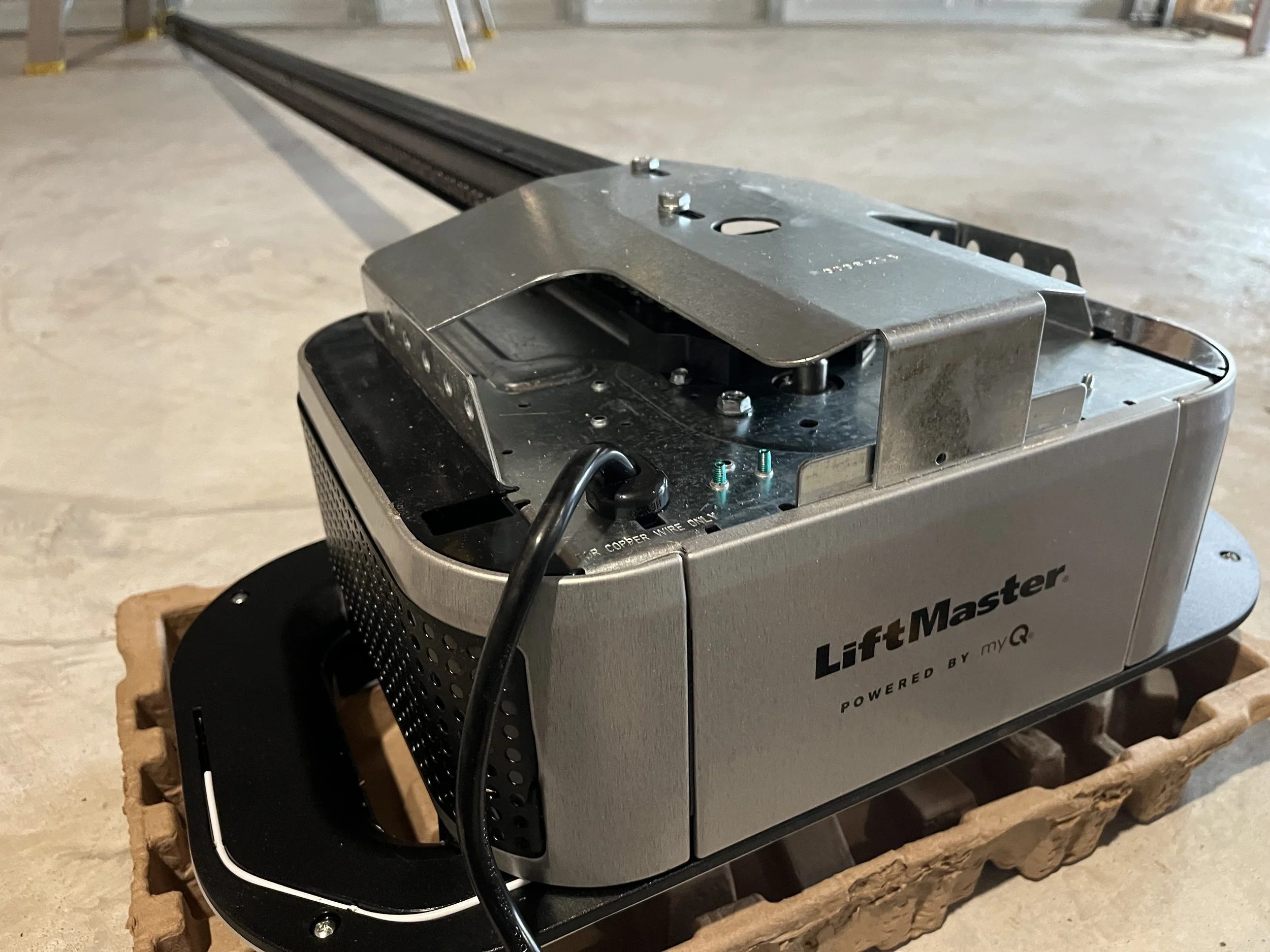 Heavy duty liftmaster with reinforced motor, and rail