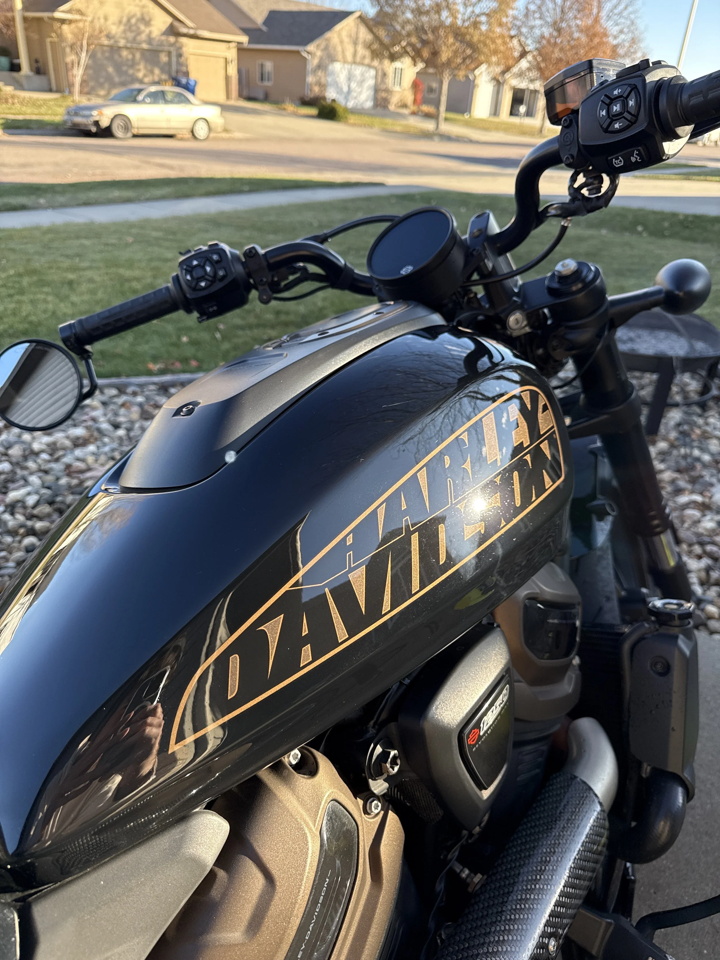 Vehicle interior after professional interior detailing, showing center console and clean surfaces.
