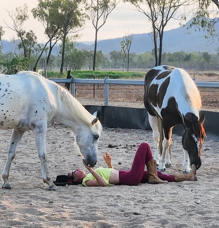 Woman interacting with horses