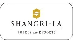 Shangri-La Hotels and Resorts logo in gold and black text on a white background.