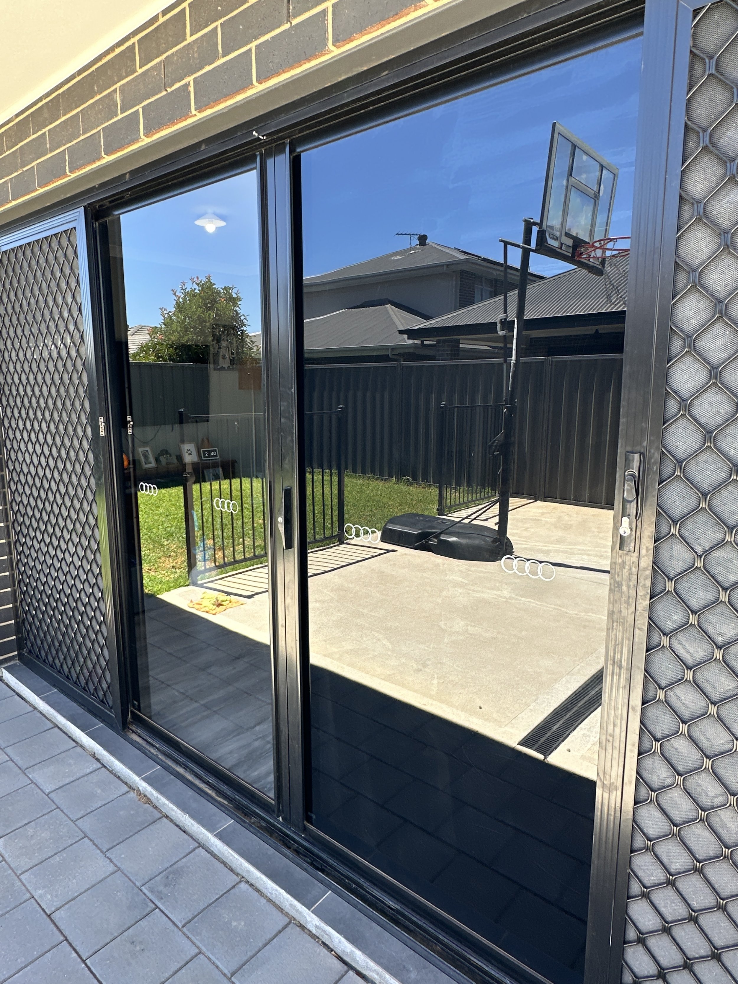 Sliding glass door window dark tinted - before and after.